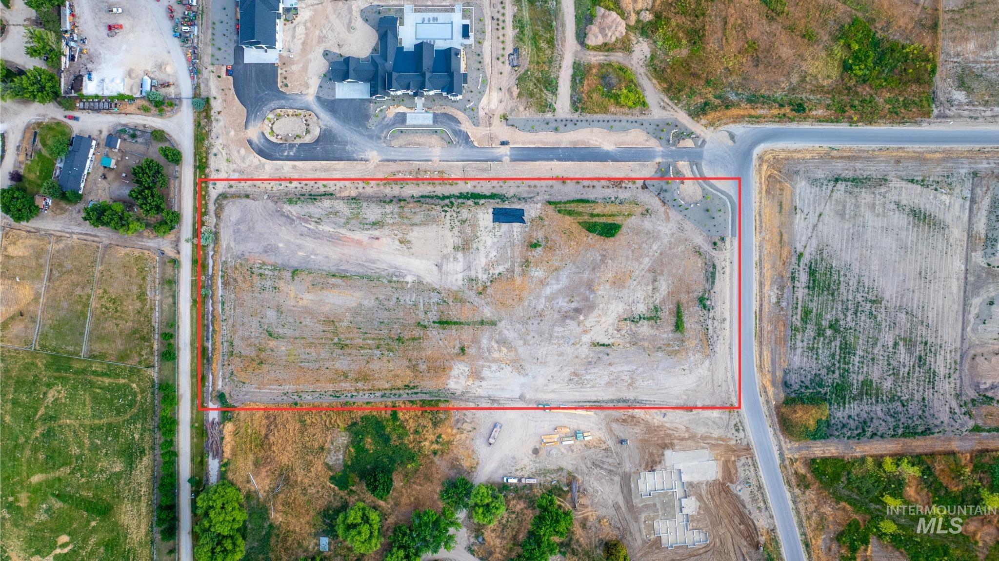 Aerial overview of property's location featuring property parcel outlined
