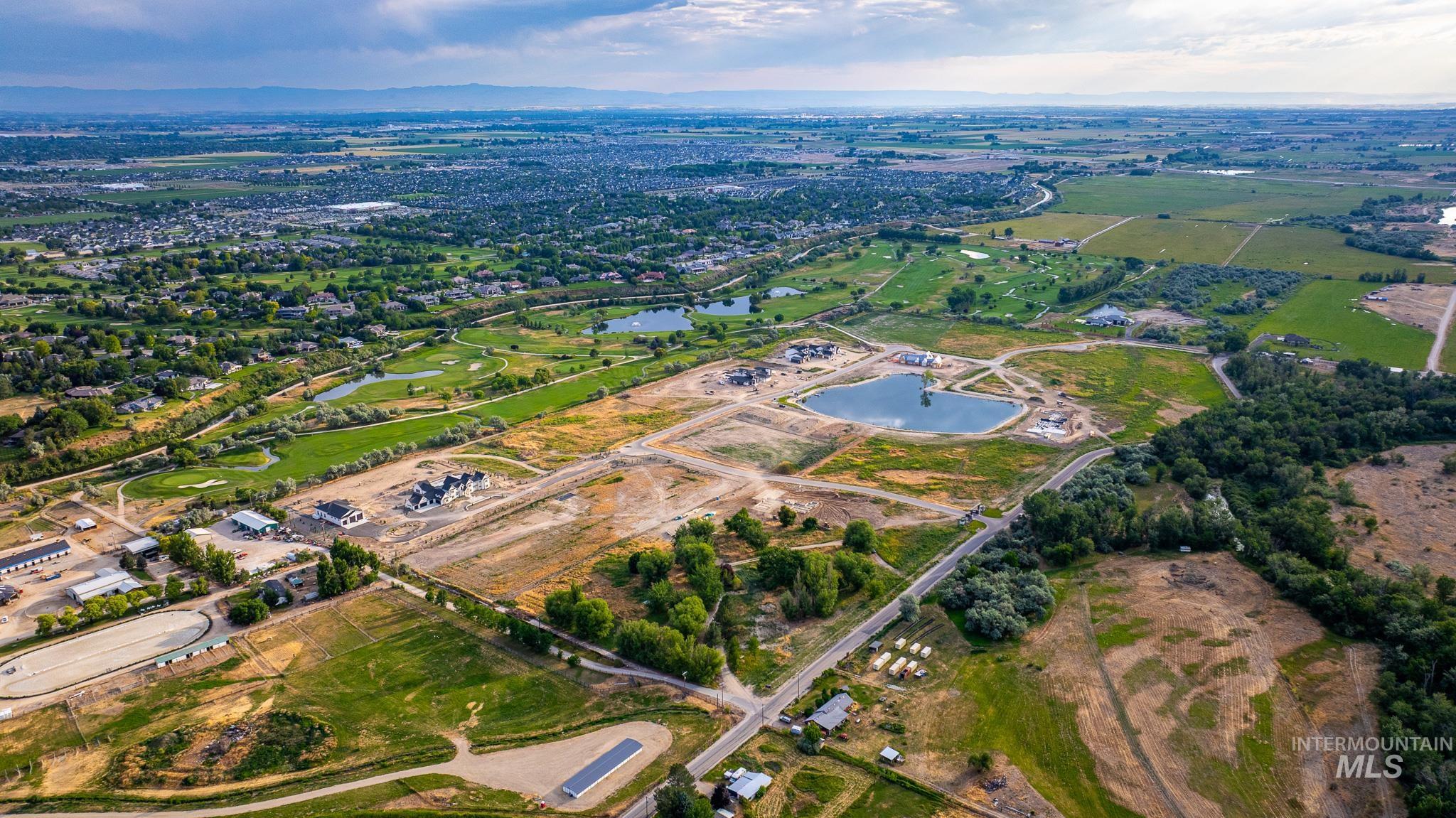Aerial view of property and surrounding area featuring a large body of water