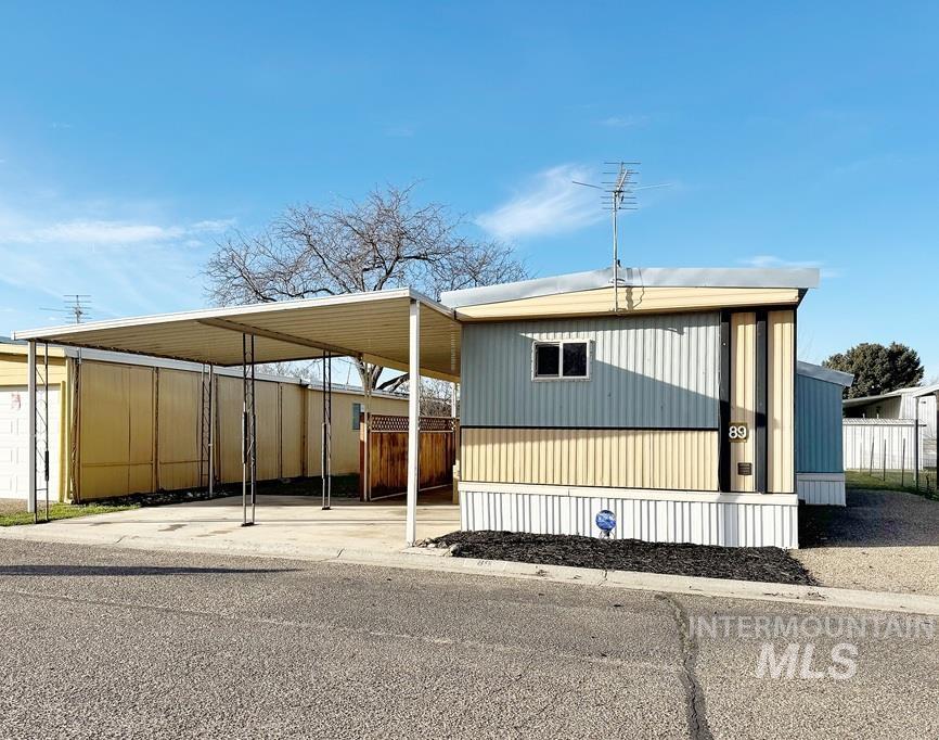 View of front of home featuring a carport