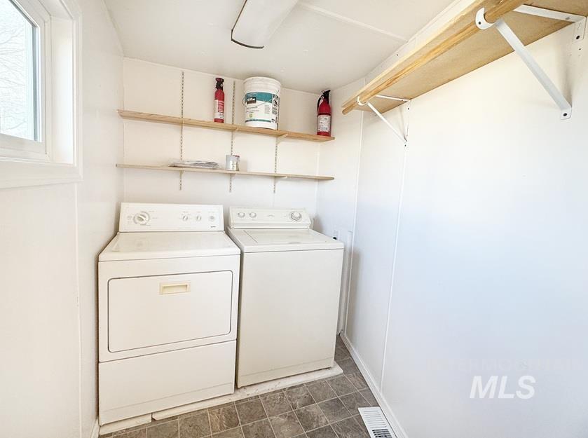 Laundry area featuring separate washer and dryer