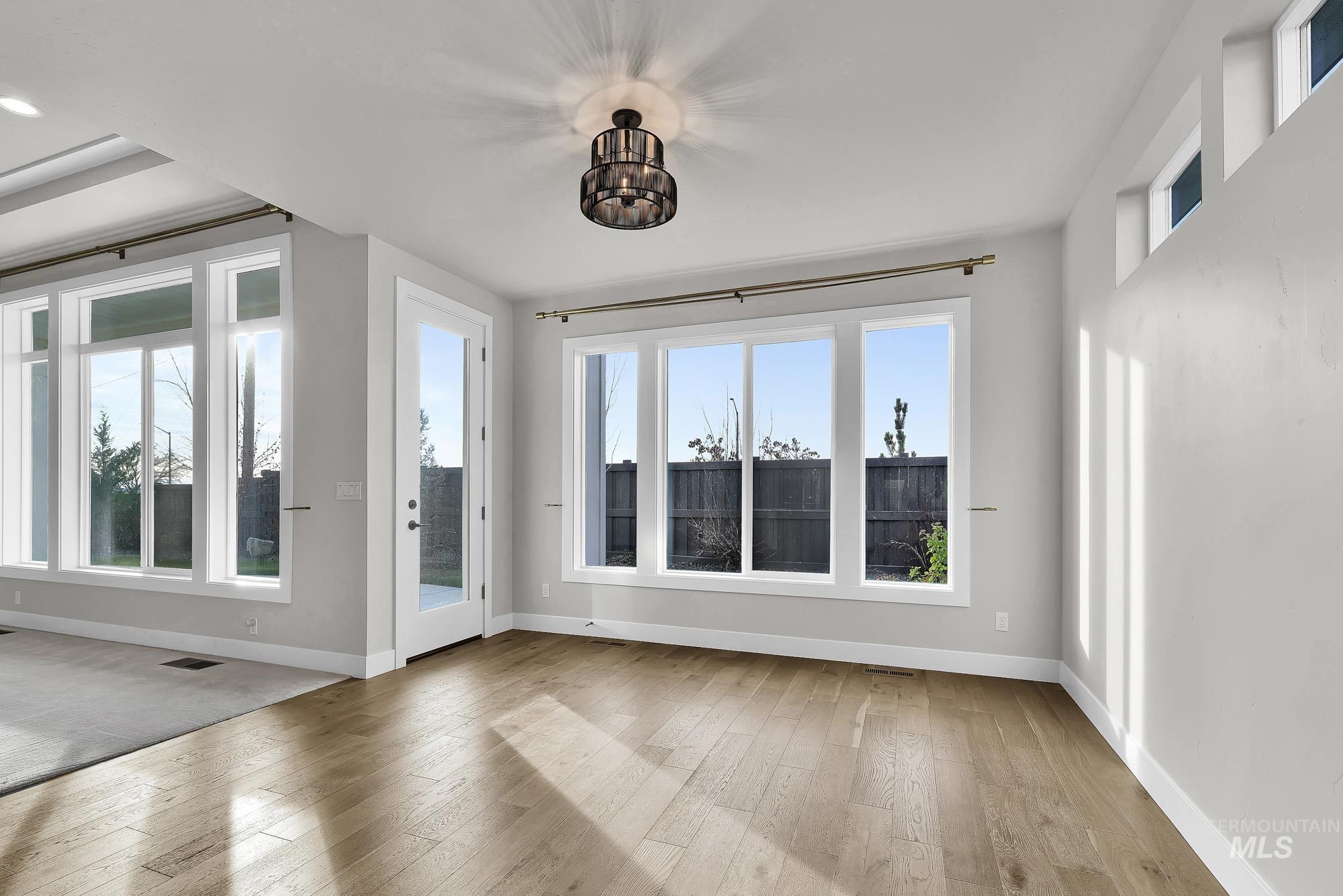 Foyer featuring healthy amount of natural light and light wood-type flooring