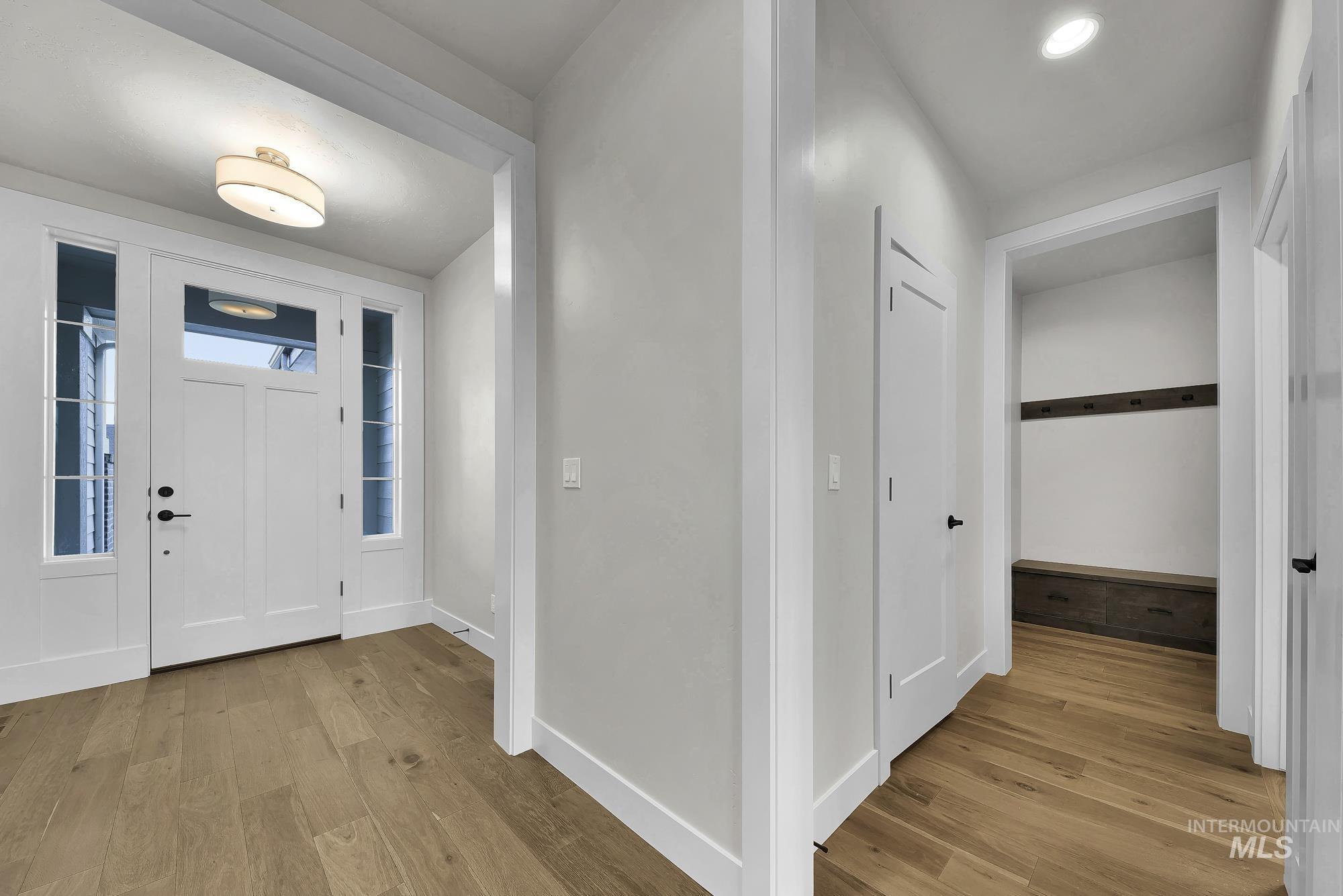 Entrance foyer featuring light wood finished floors and baseboards