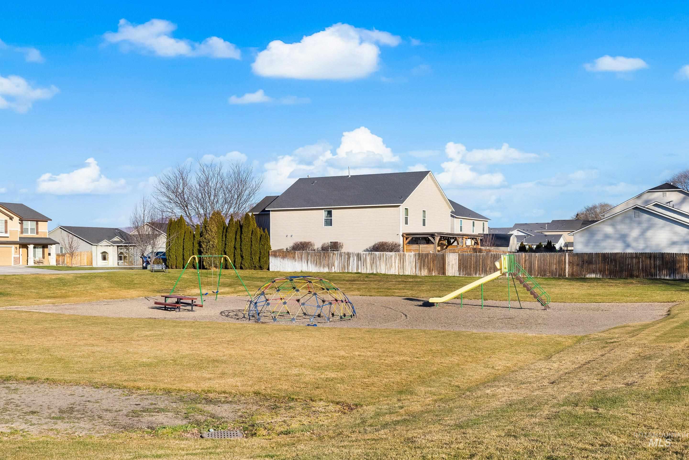 Rear view of property with a residential view and a patio