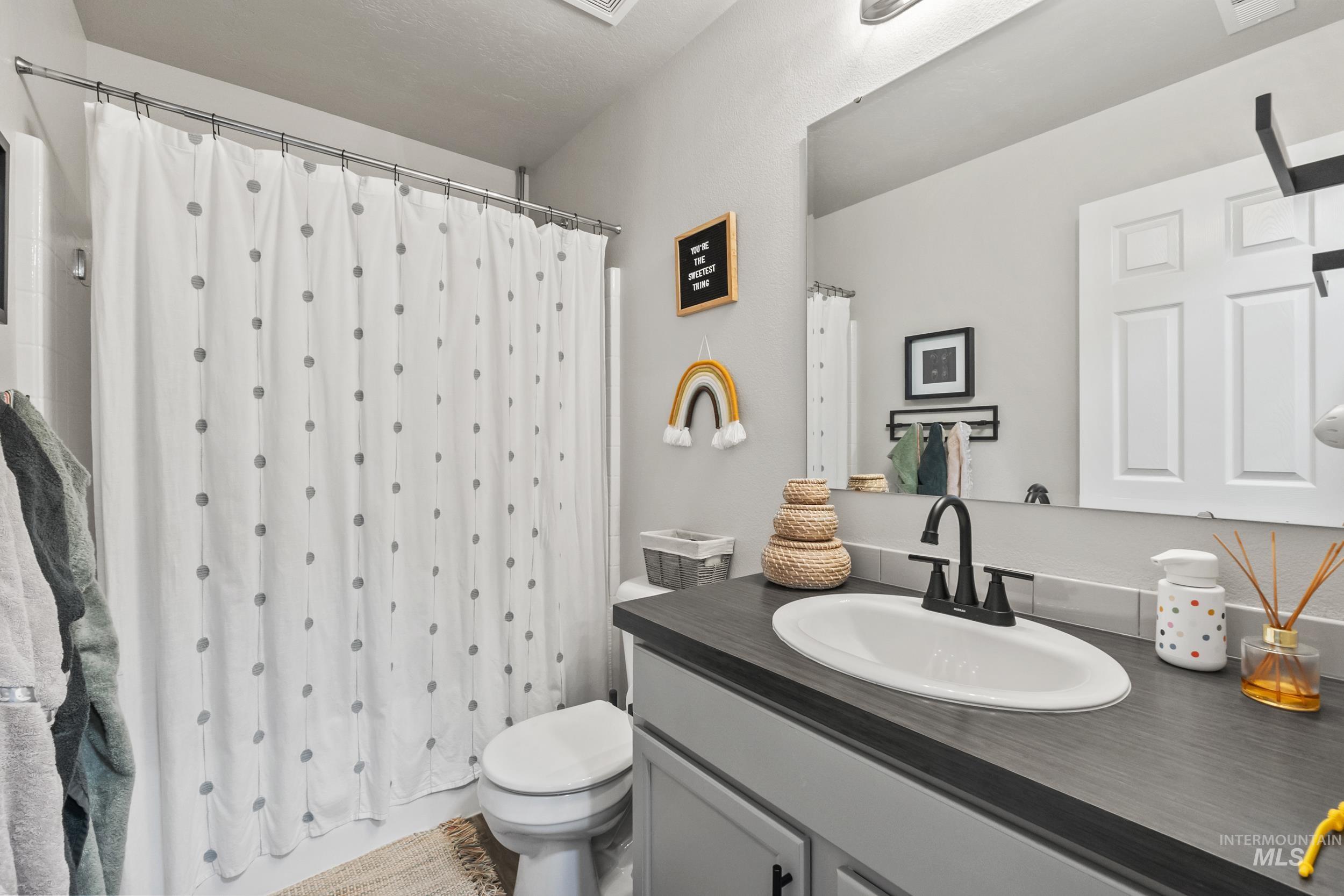 Bathroom with vanity and toilet