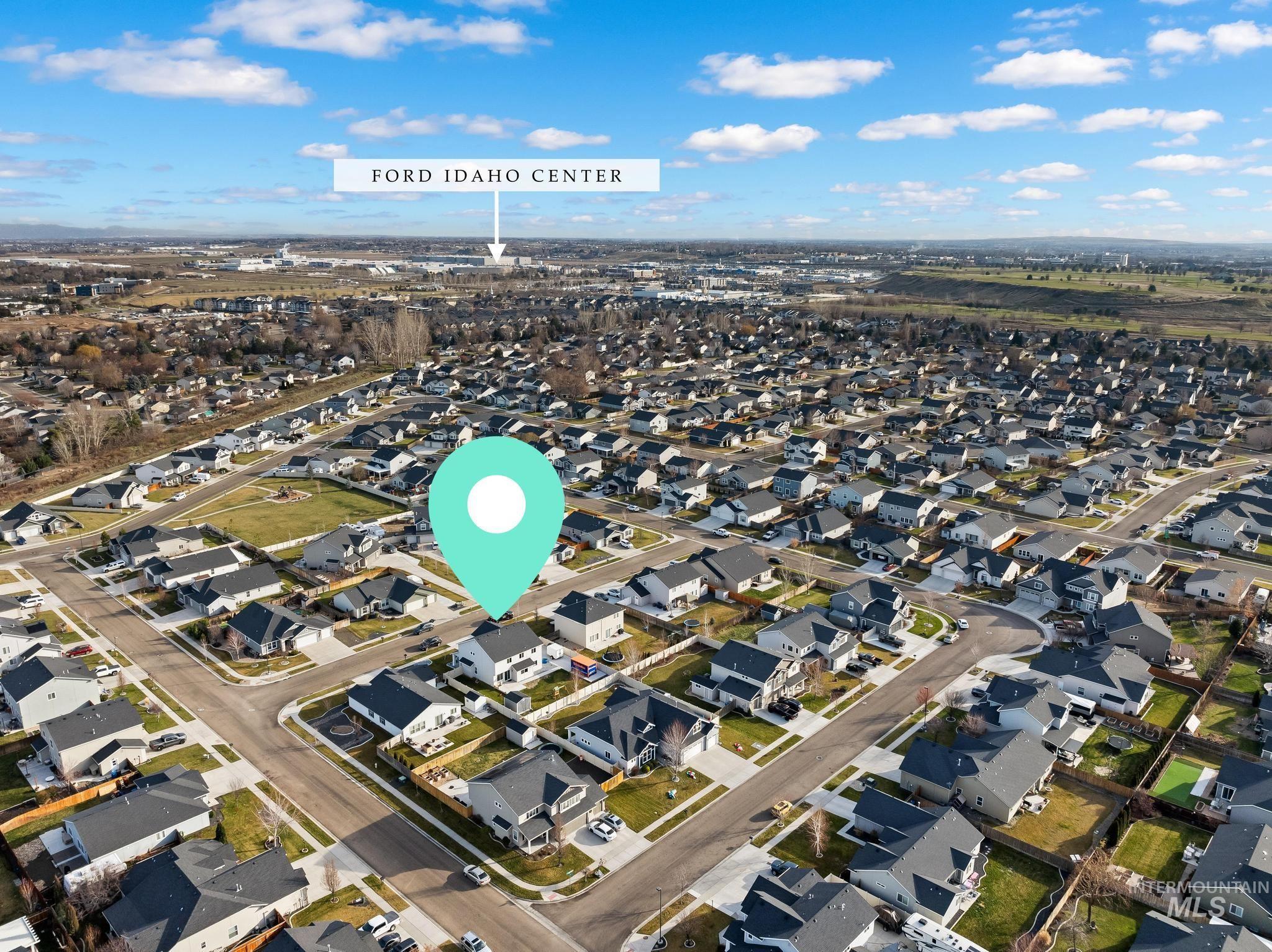 Aerial overview of property's location with nearby suburban area