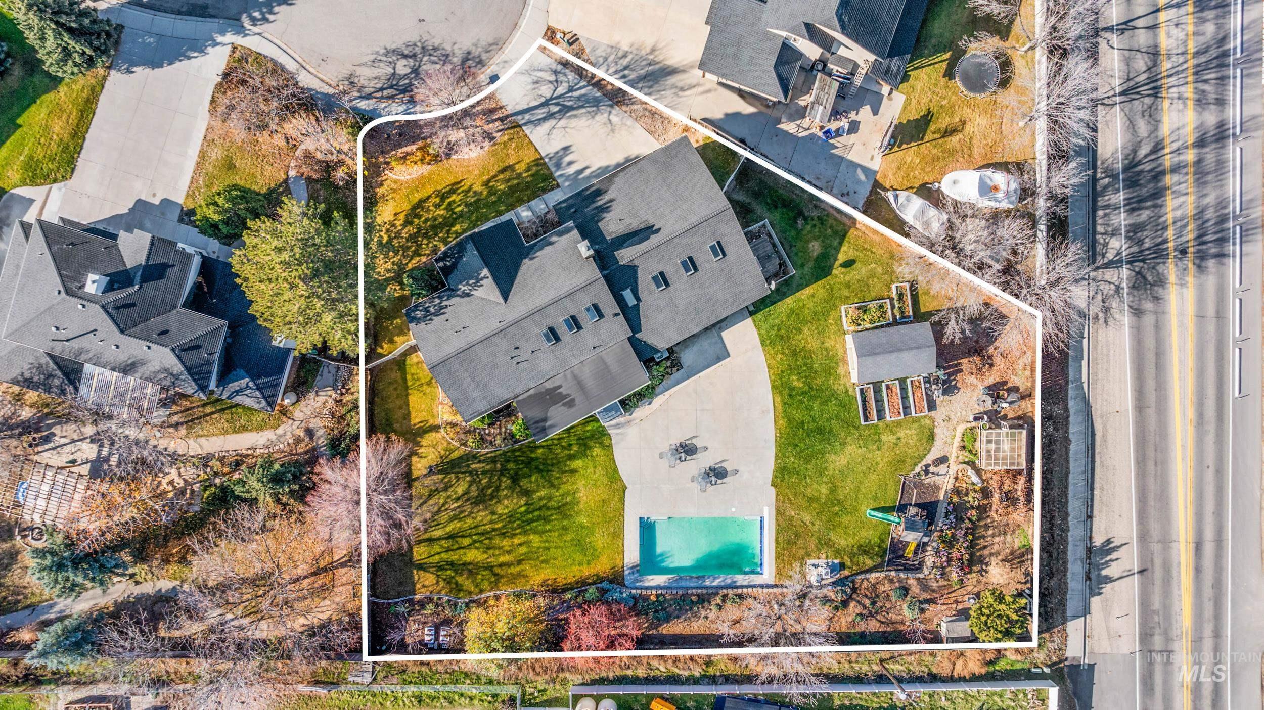 Aerial perspective of suburban area with a pool area