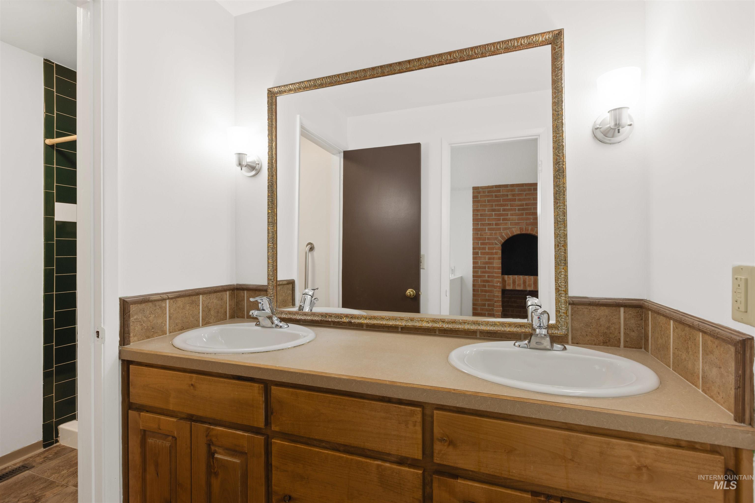 Bathroom featuring double vanity
