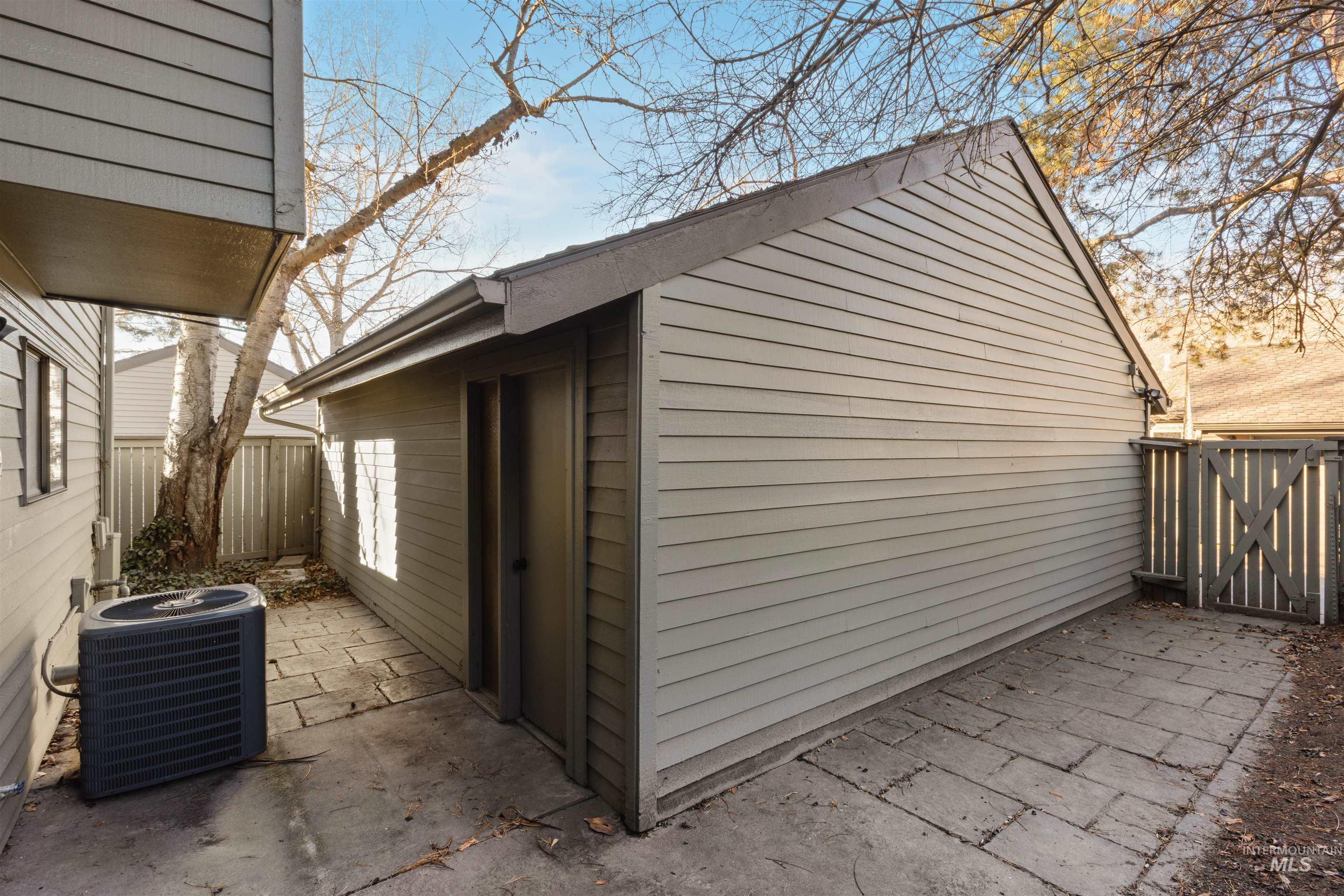 View of outdoor structure featuring a fenced backyard