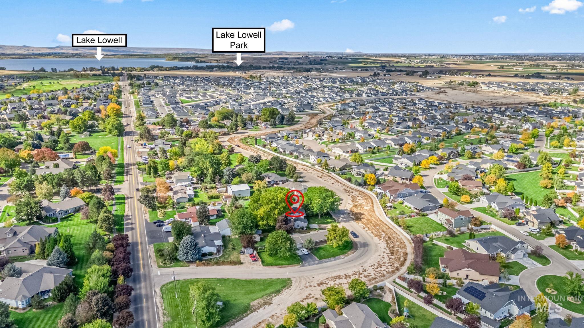 Aerial overview of property's location with nearby suburban area