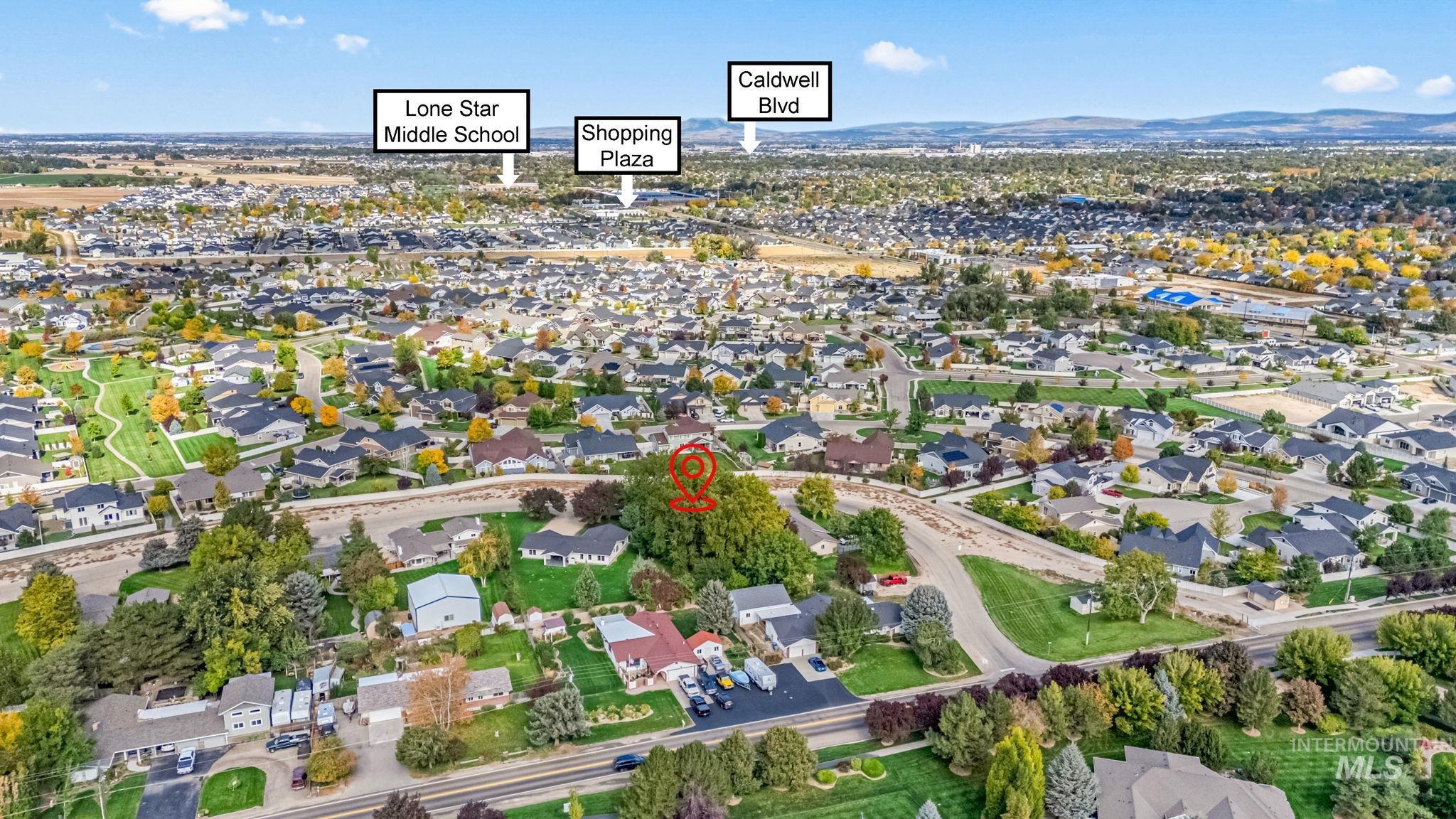 Aerial overview of property's location with nearby suburban area