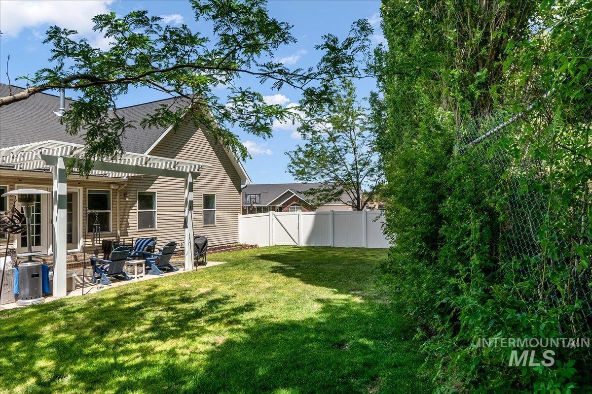 View of yard featuring a pergola and a patio