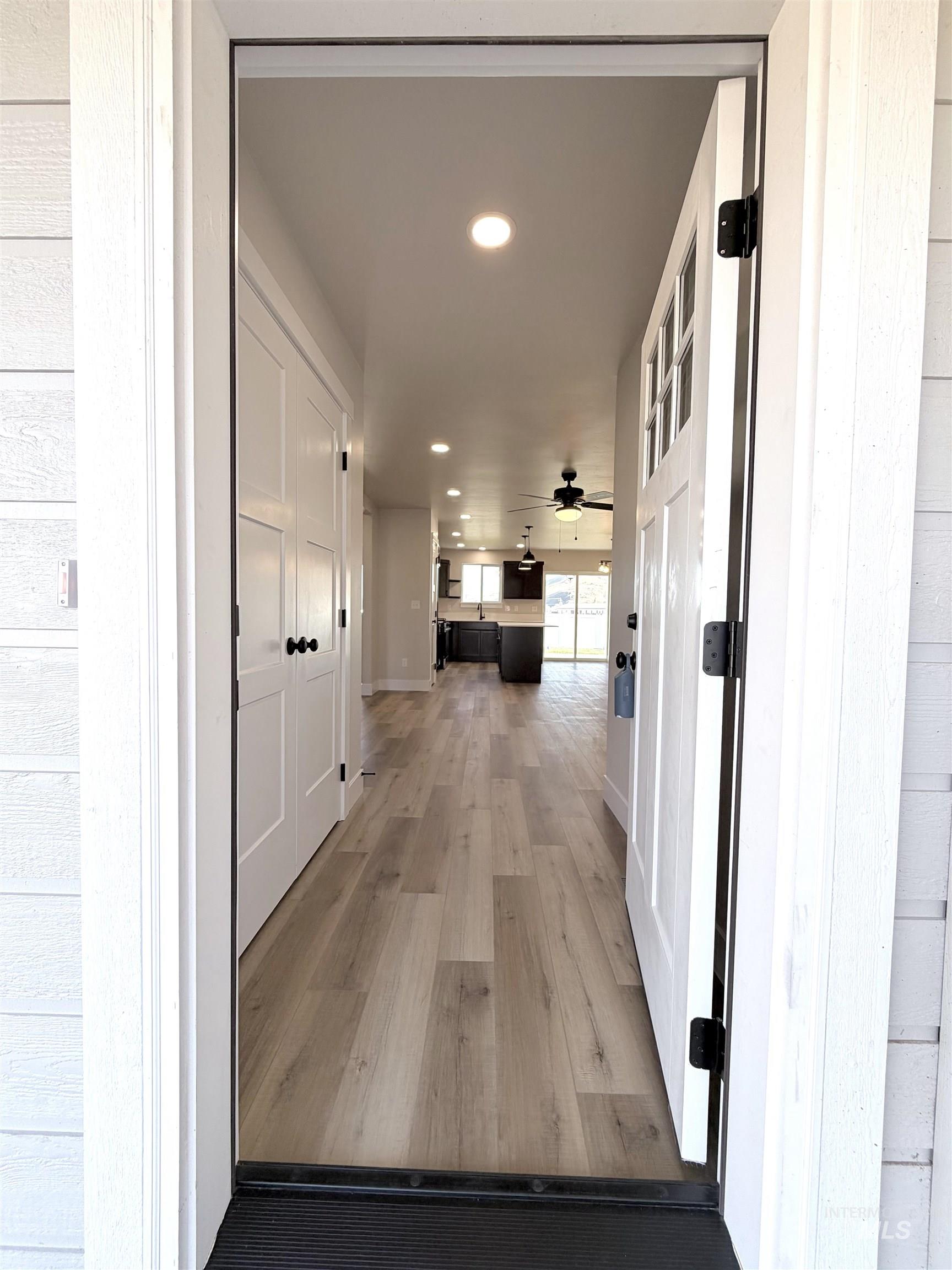 Corridor featuring recessed lighting and light wood-type flooring