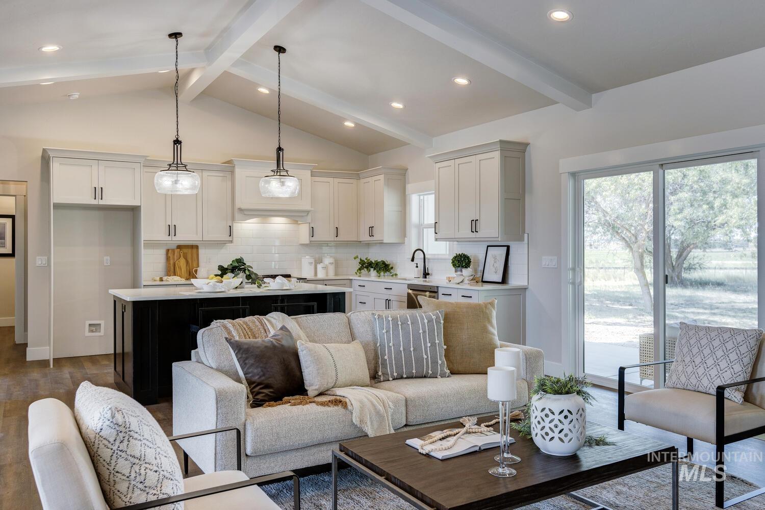 Living area featuring dark wood-style floors and recessed lighting