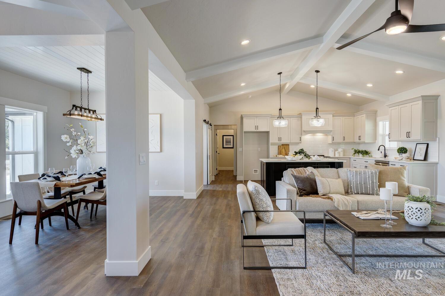 Living room with dark wood-style floors and baseboards