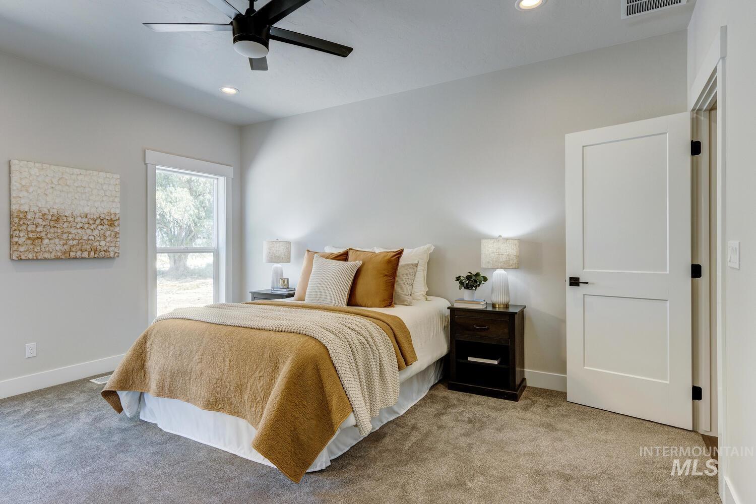 Bedroom featuring light colored carpet, recessed lighting, and ceiling fan