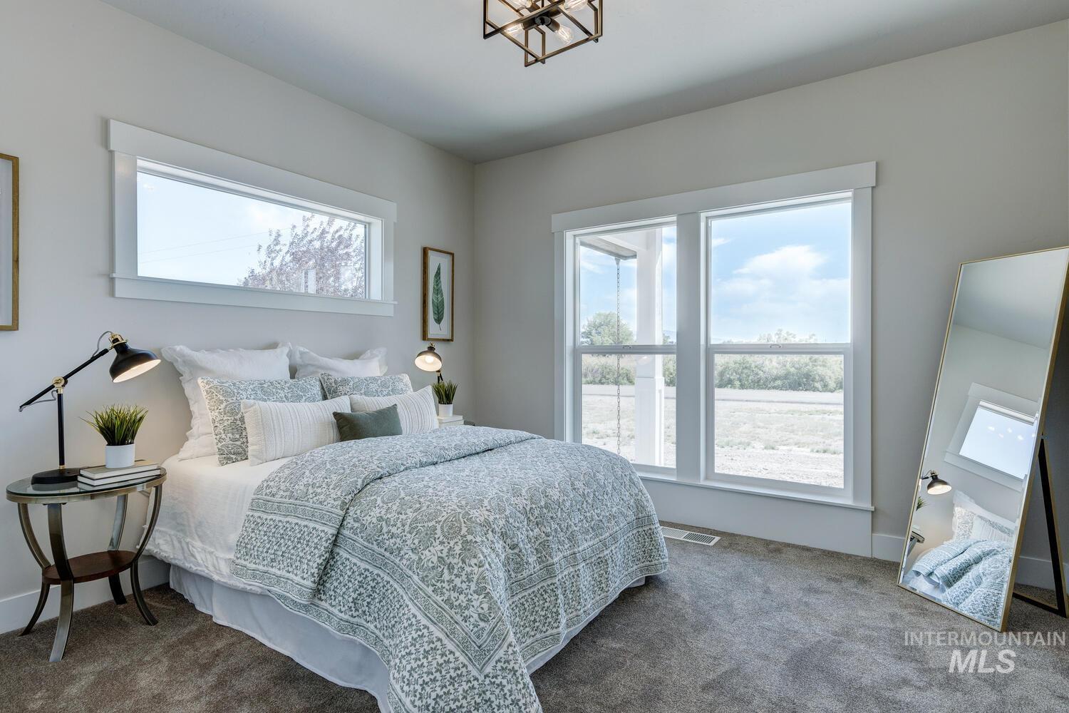 Carpeted bedroom with baseboards