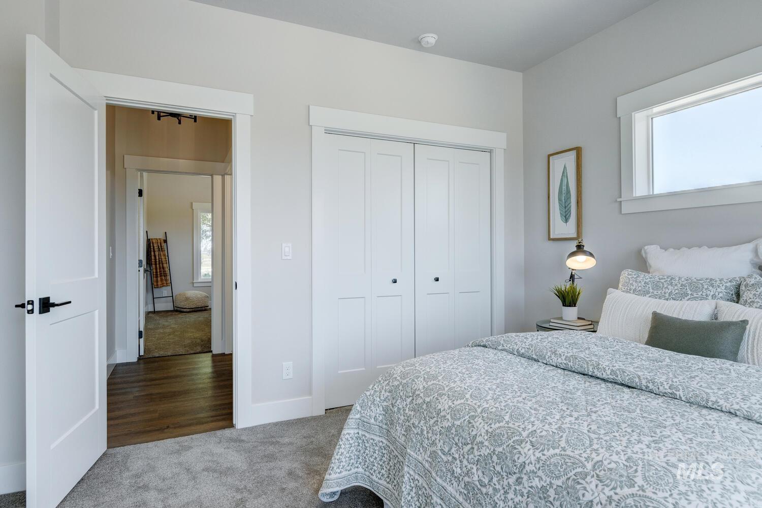 Bedroom with carpet flooring and a closet
