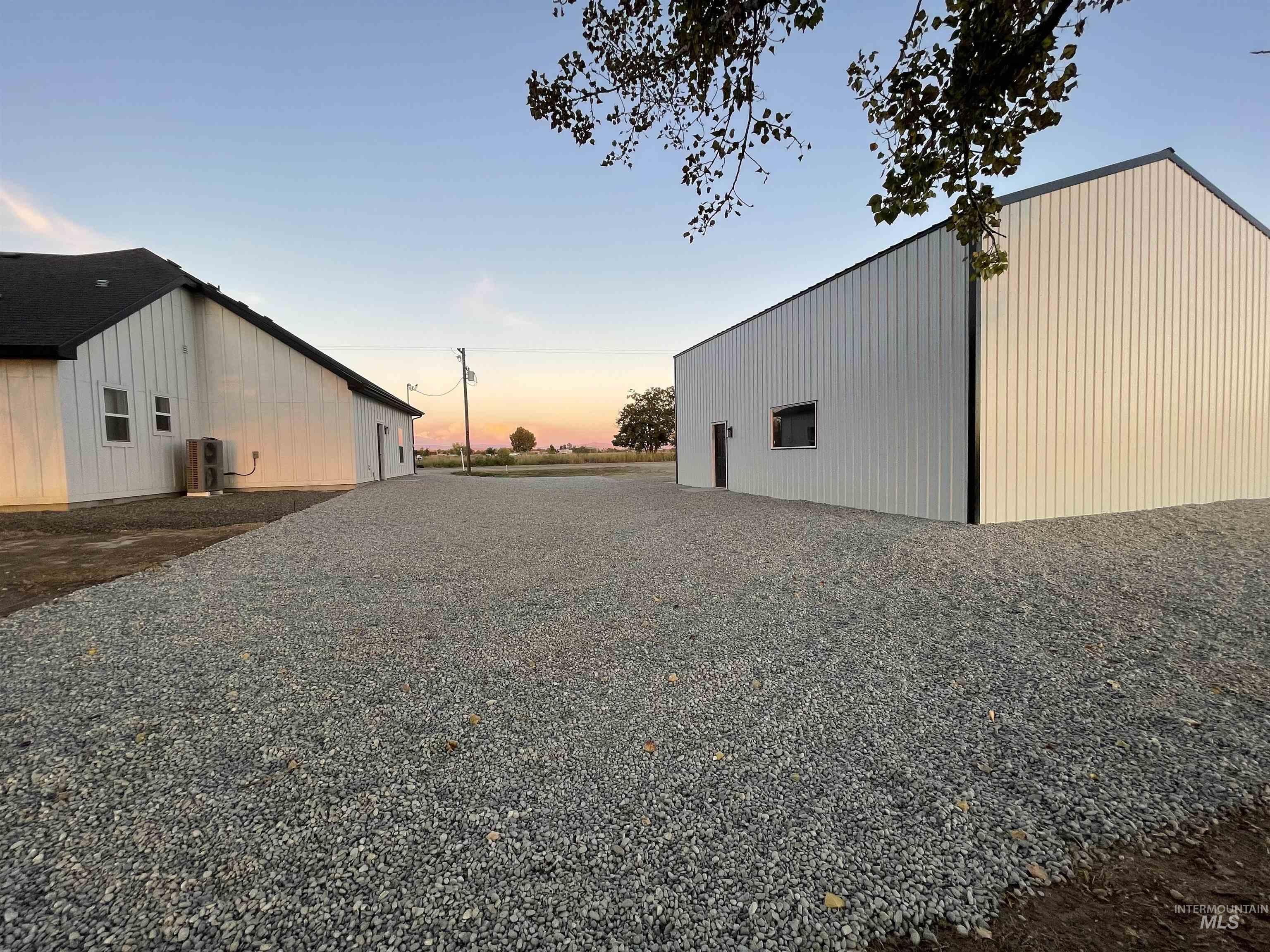 Yard at dusk featuring an outbuilding