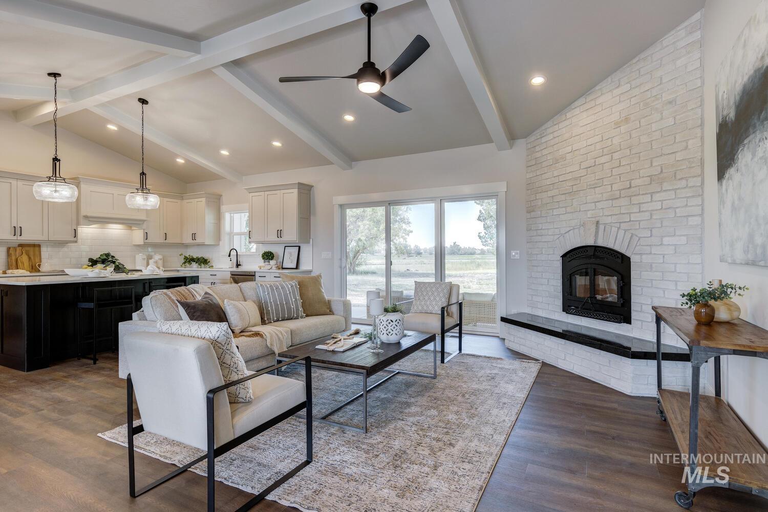 Living area with a fireplace, wood finished floors, a ceiling fan, and recessed lighting