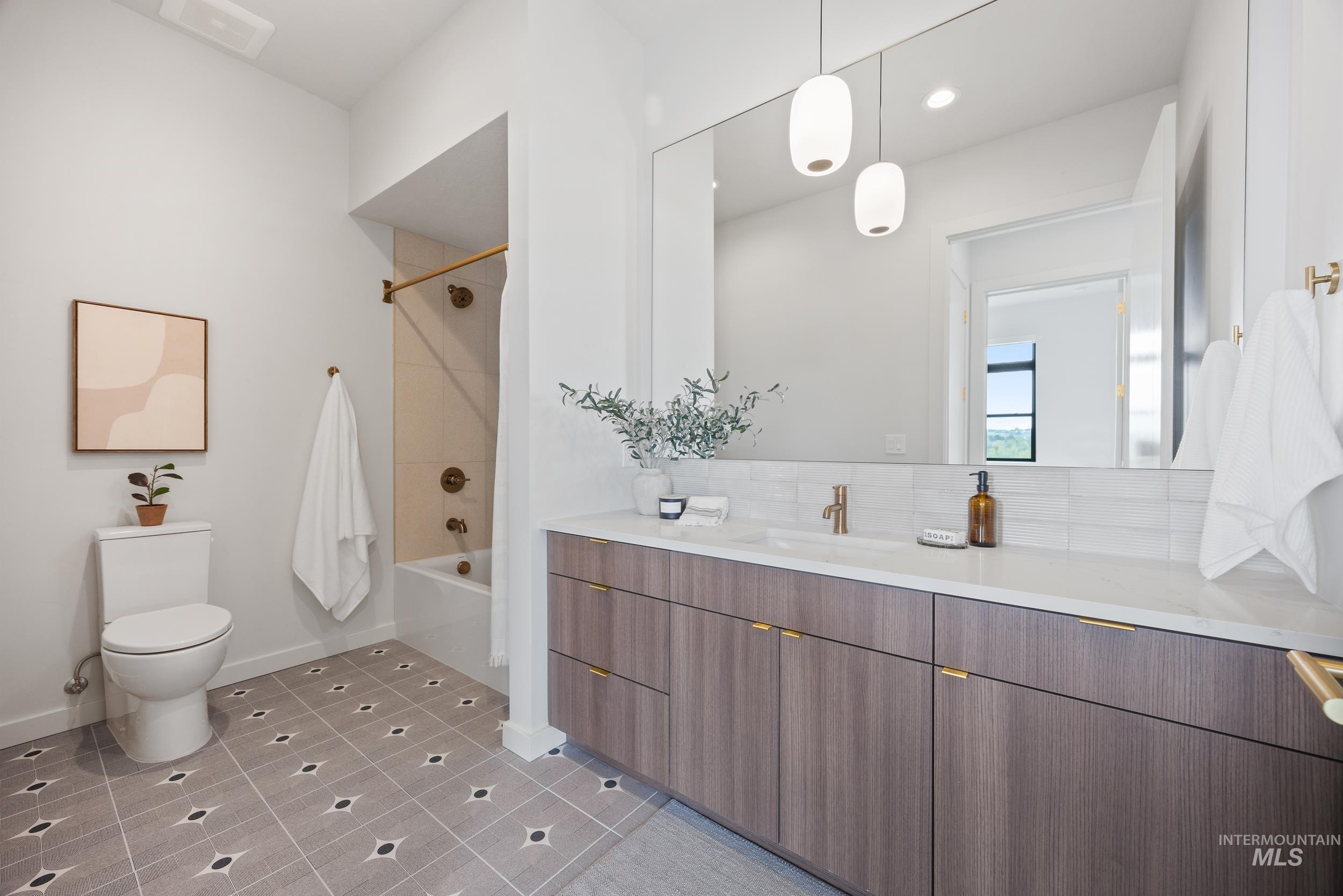 Bathroom with  shower combination, vanity, light tile patterned flooring, and recessed lighting
