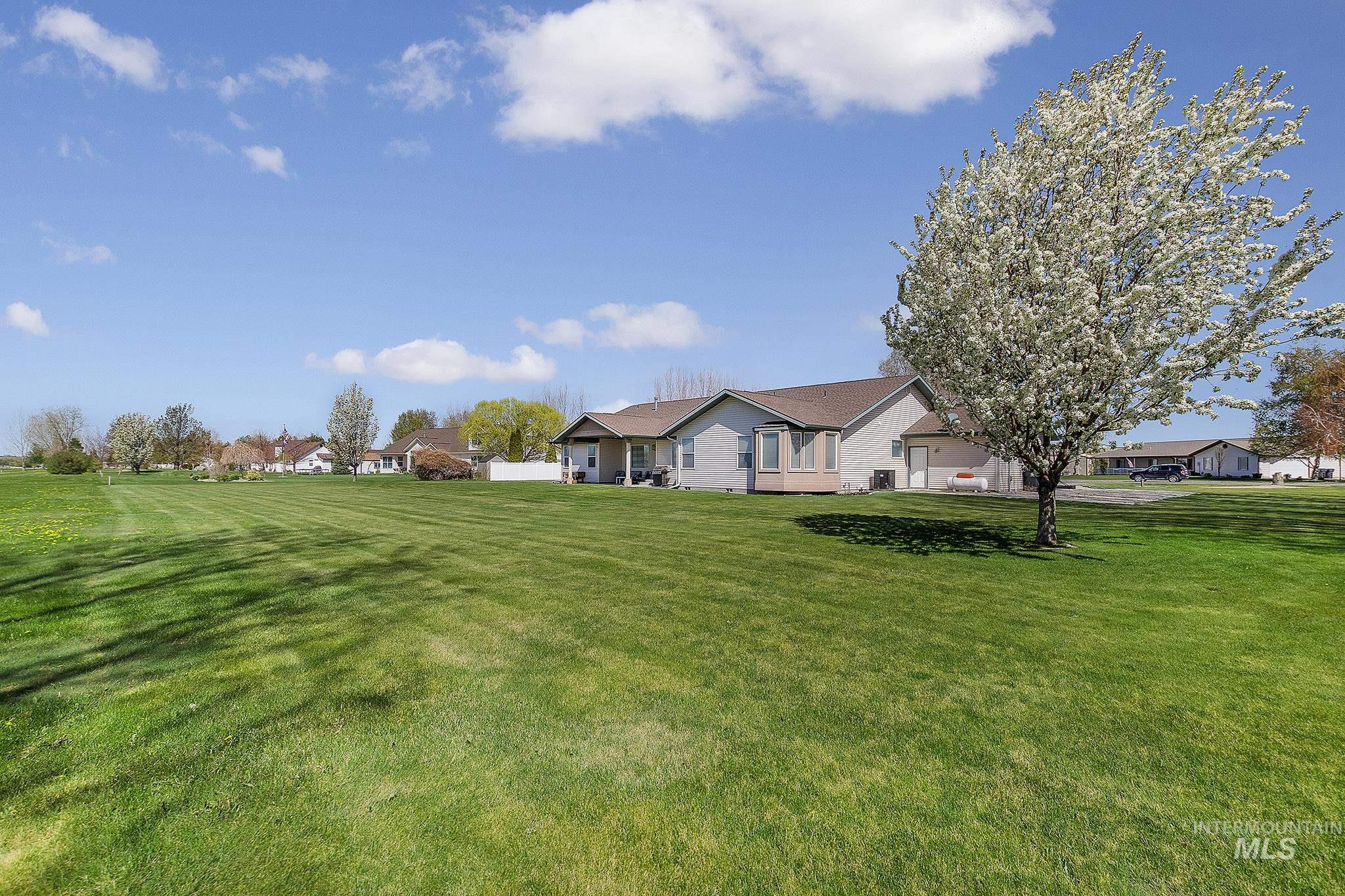 View of grassy yard with a residential view