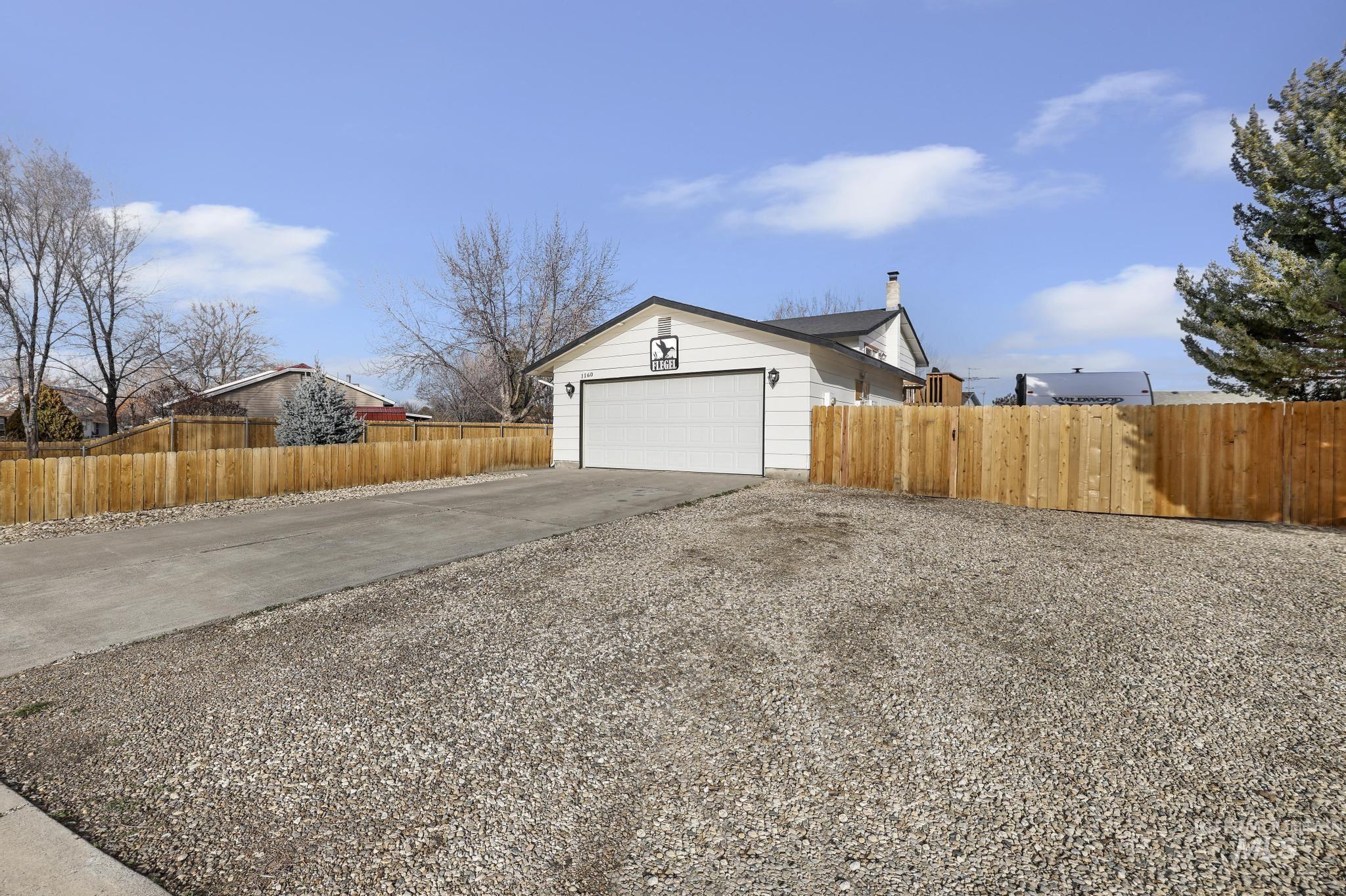Garage with concrete driveway