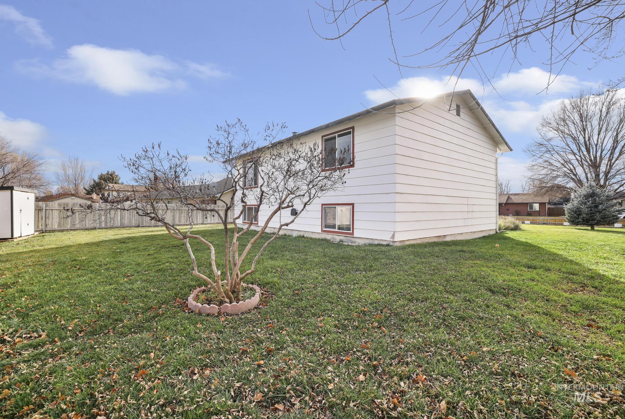View of home's exterior featuring an outdoor structure