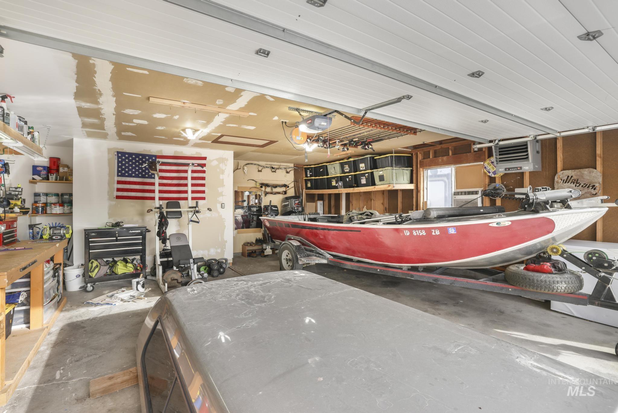 Garage with a workshop area and a heating unit