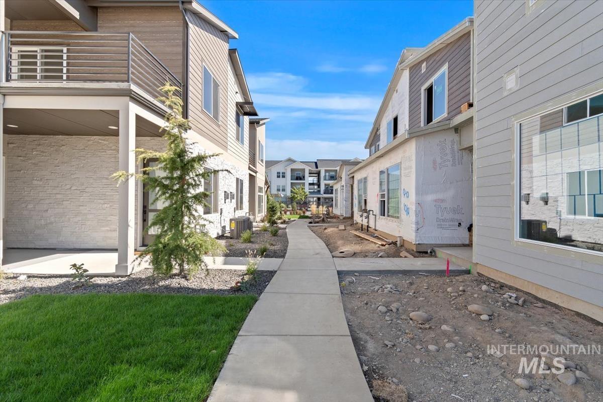 View of community featuring a residential view and a lawn