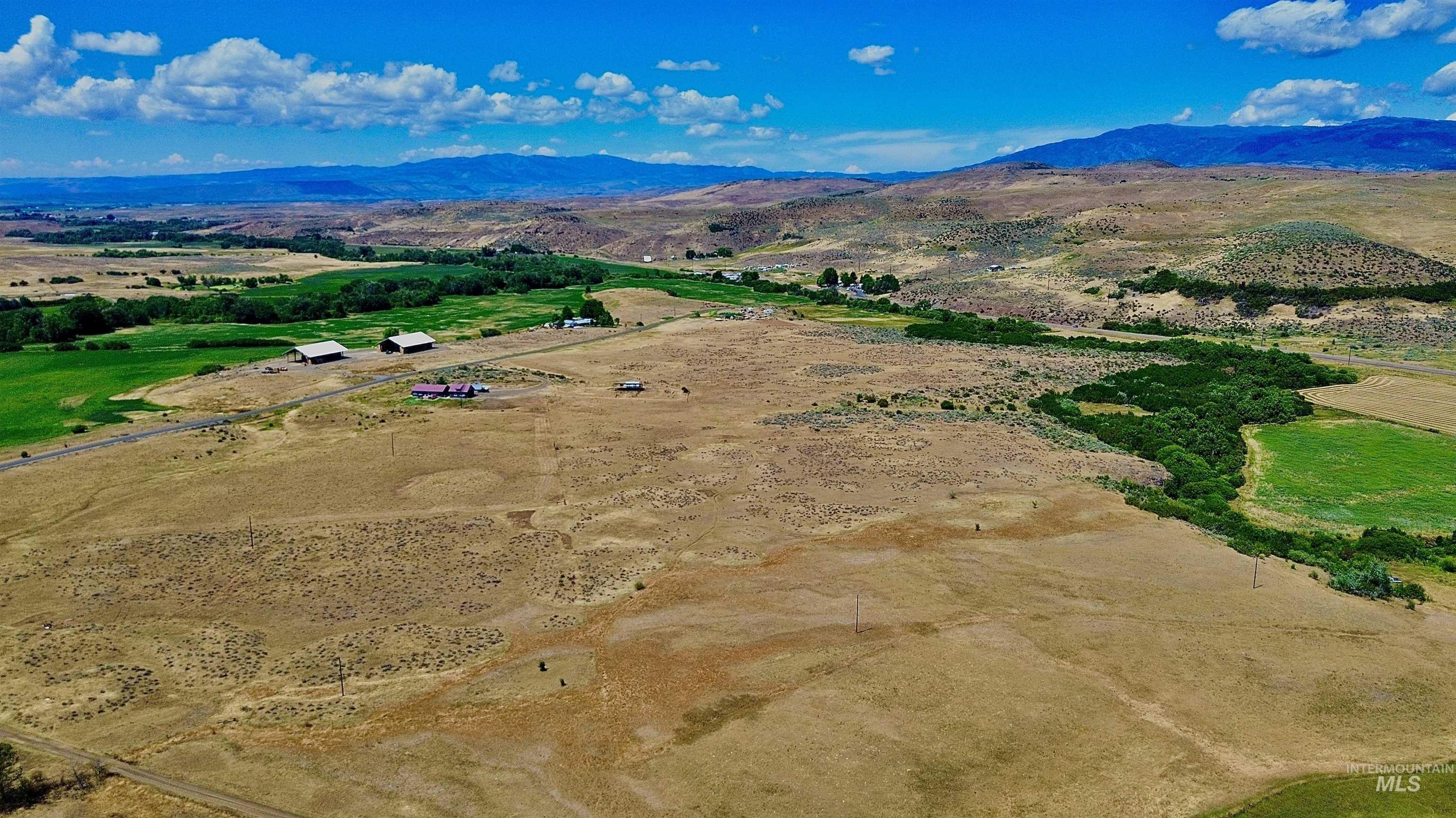 Aerial view of sparsely populated area with a mountainous background