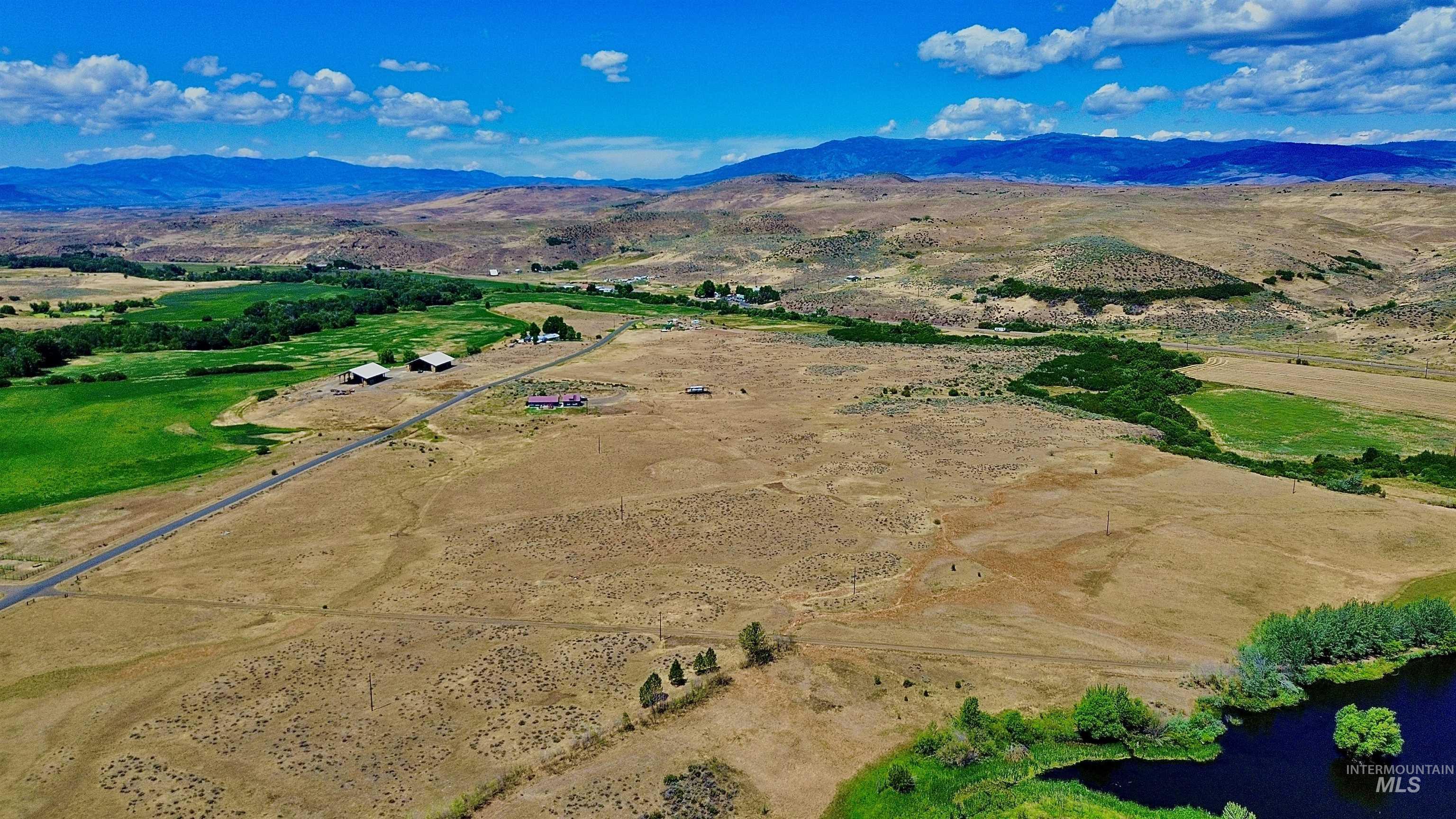Overview of rural landscape featuring a mountain backdrop