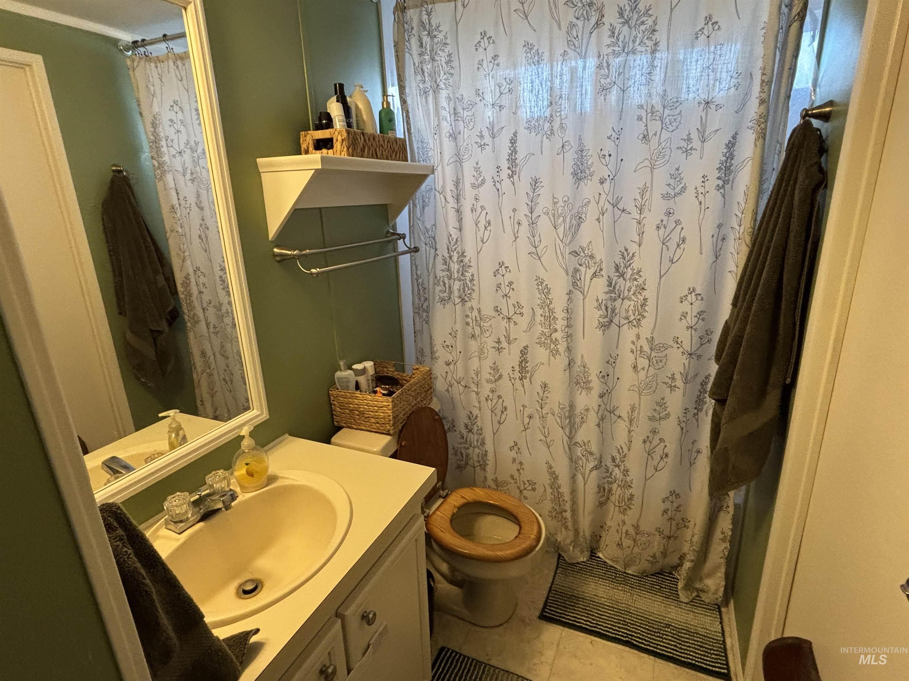 Bathroom with vanity and tile patterned flooring