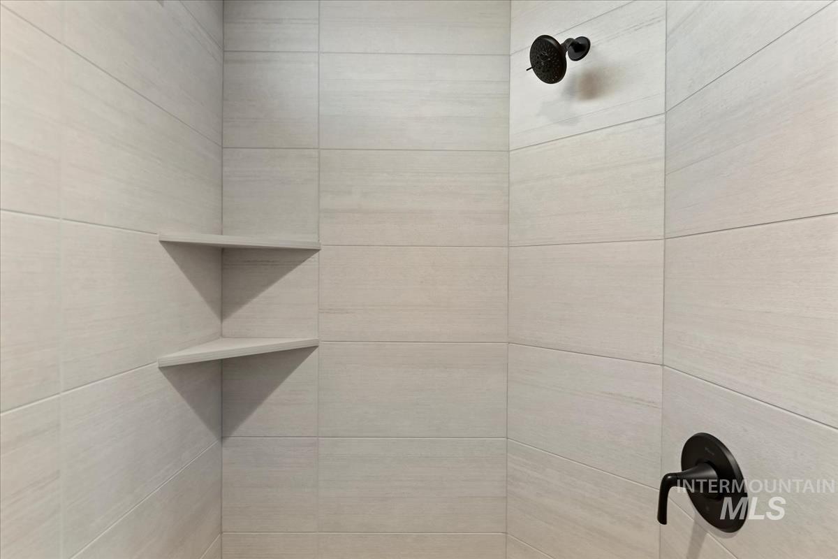 Bathroom view of a tile shower