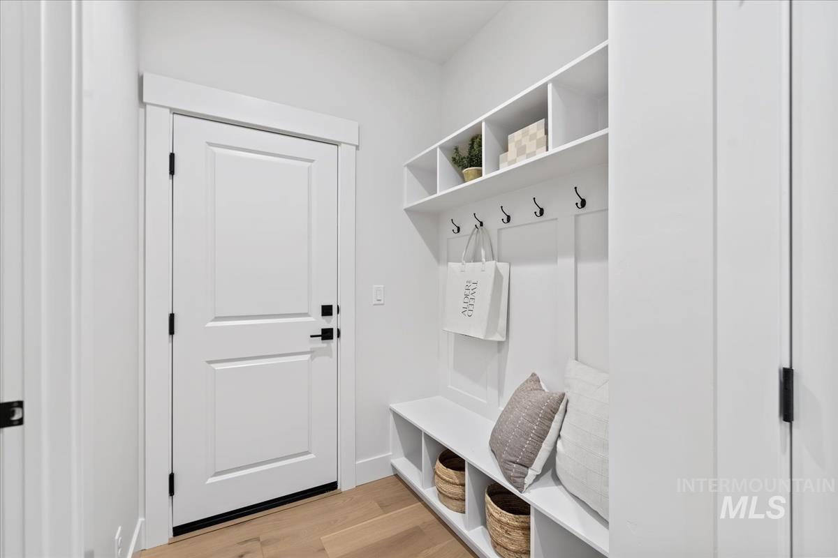 Mudroom with light wood finished floors