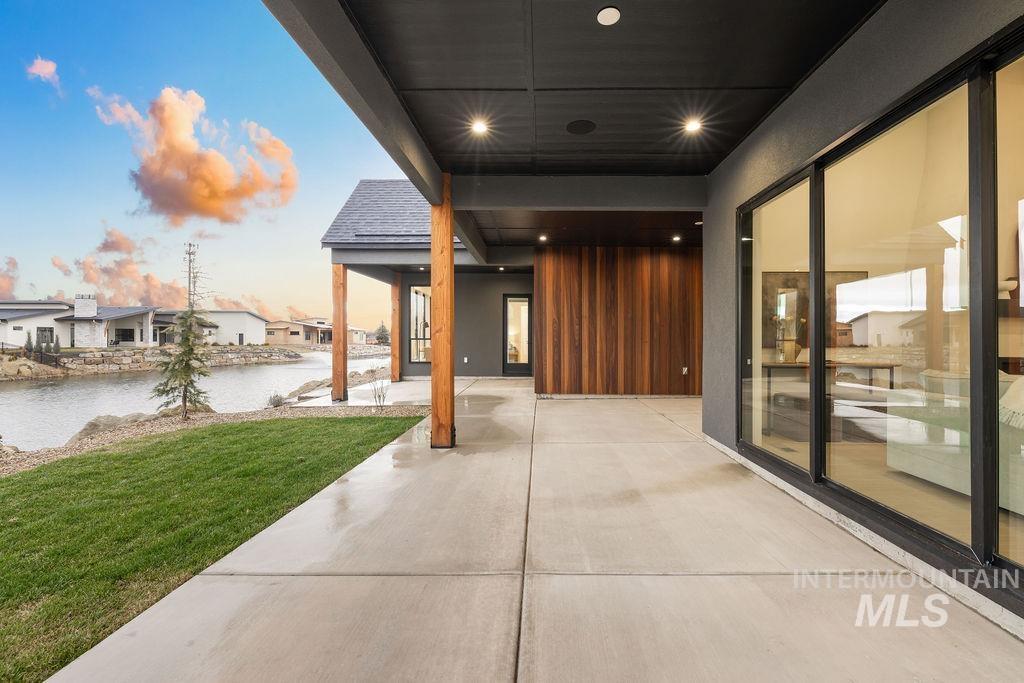 View of patio / terrace with a water view