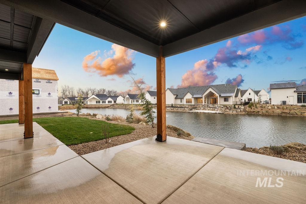 View of patio / terrace featuring a water view and a residential view
