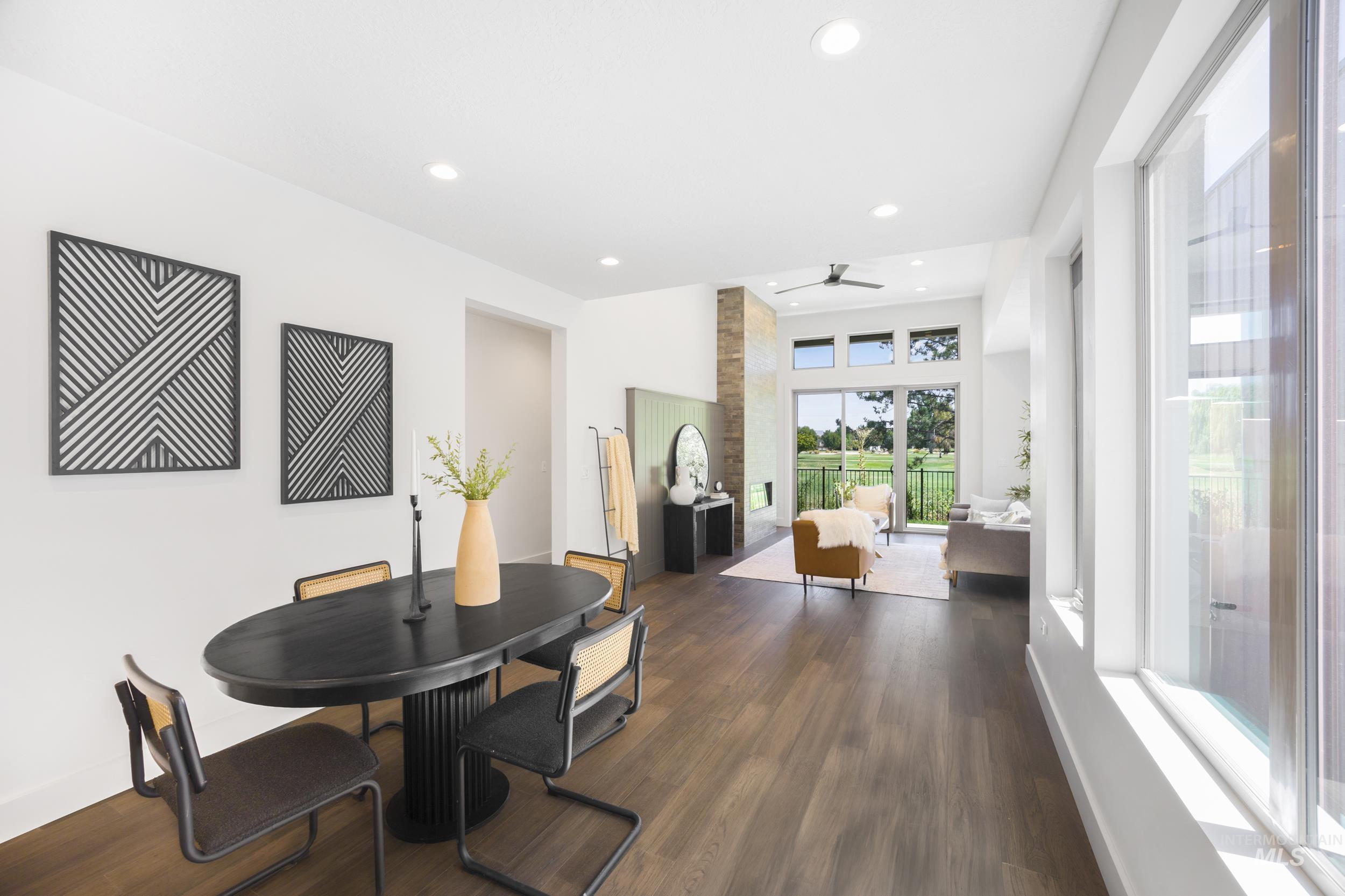 Dining room featuring dark wood-style floors, recessed lighting, and ceiling fan