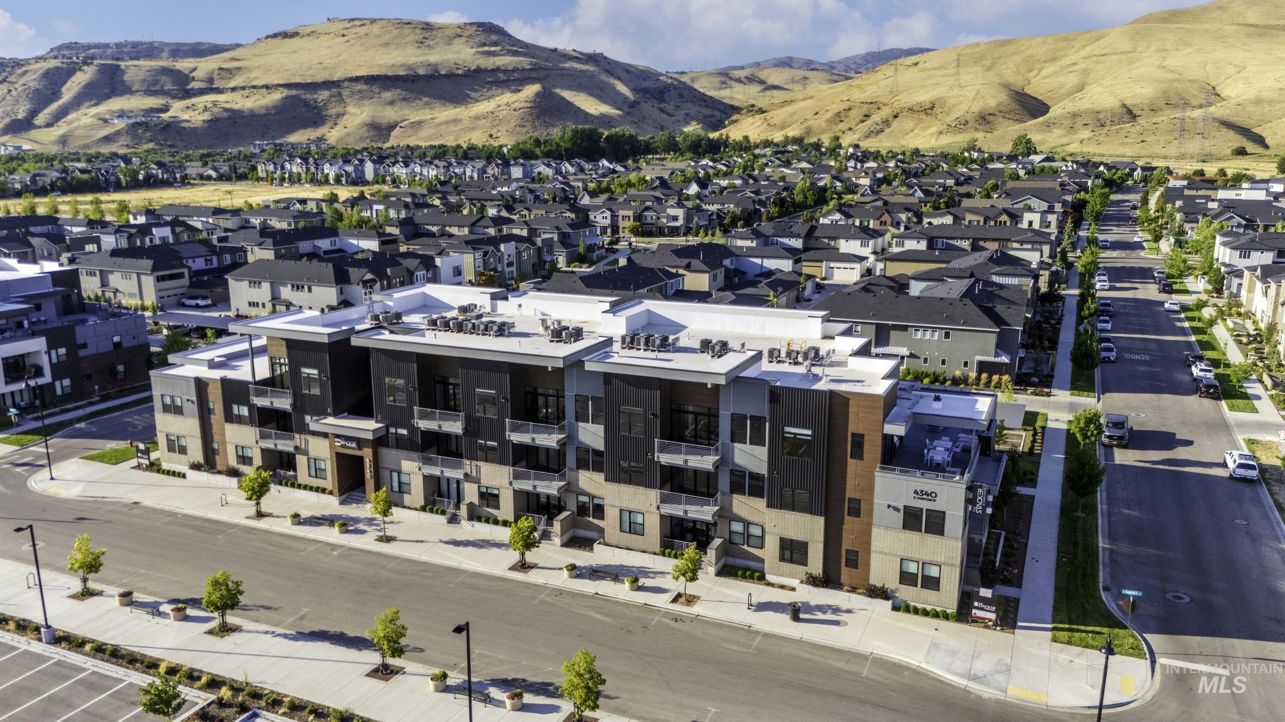 Aerial overview of property's location with a mountainous background