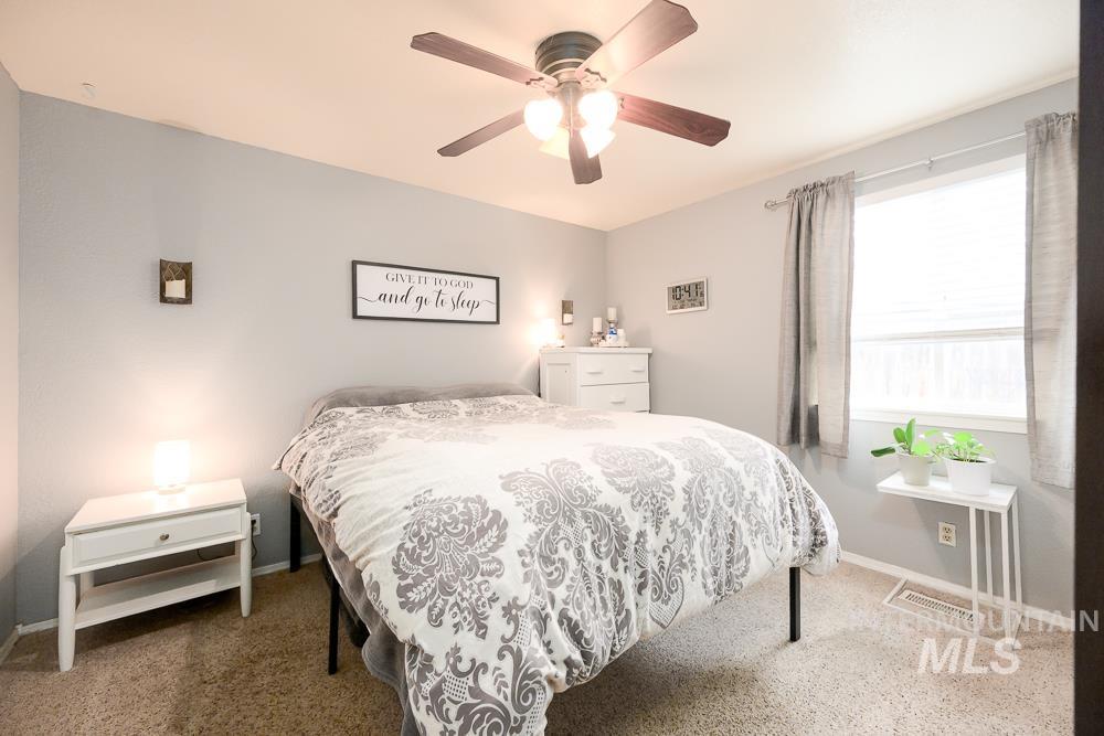 Bedroom with carpet and a ceiling fan