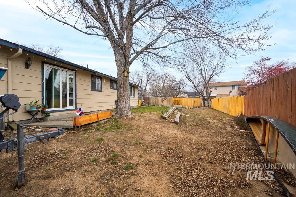 View of fenced backyard