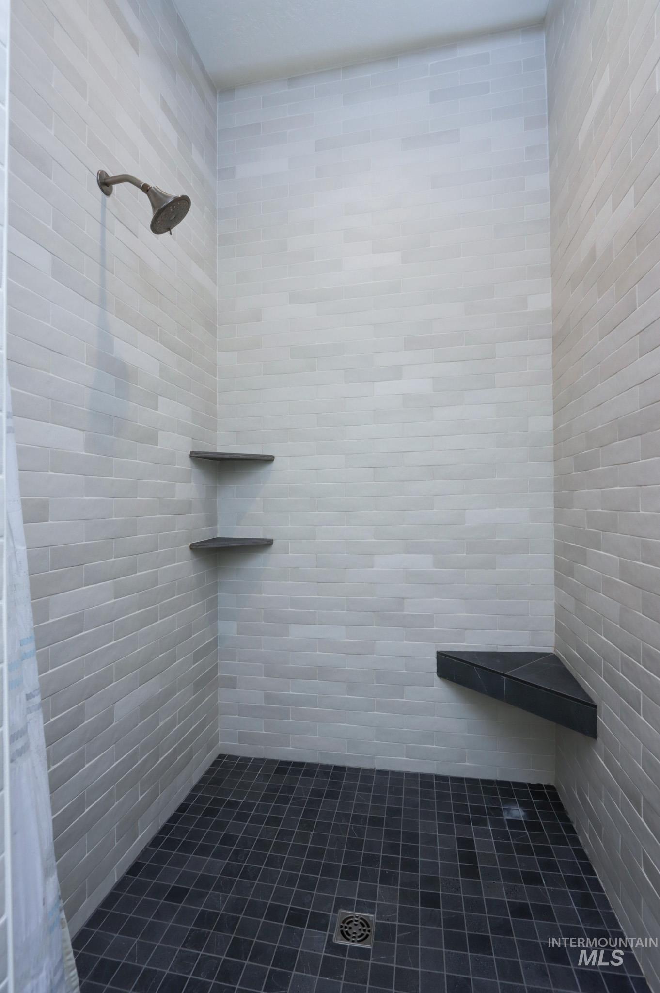 Full bathroom featuring tiled shower