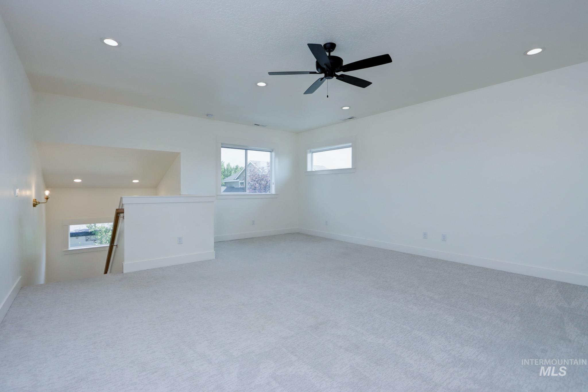 Unfurnished room featuring recessed lighting, light colored carpet, and ceiling fan
