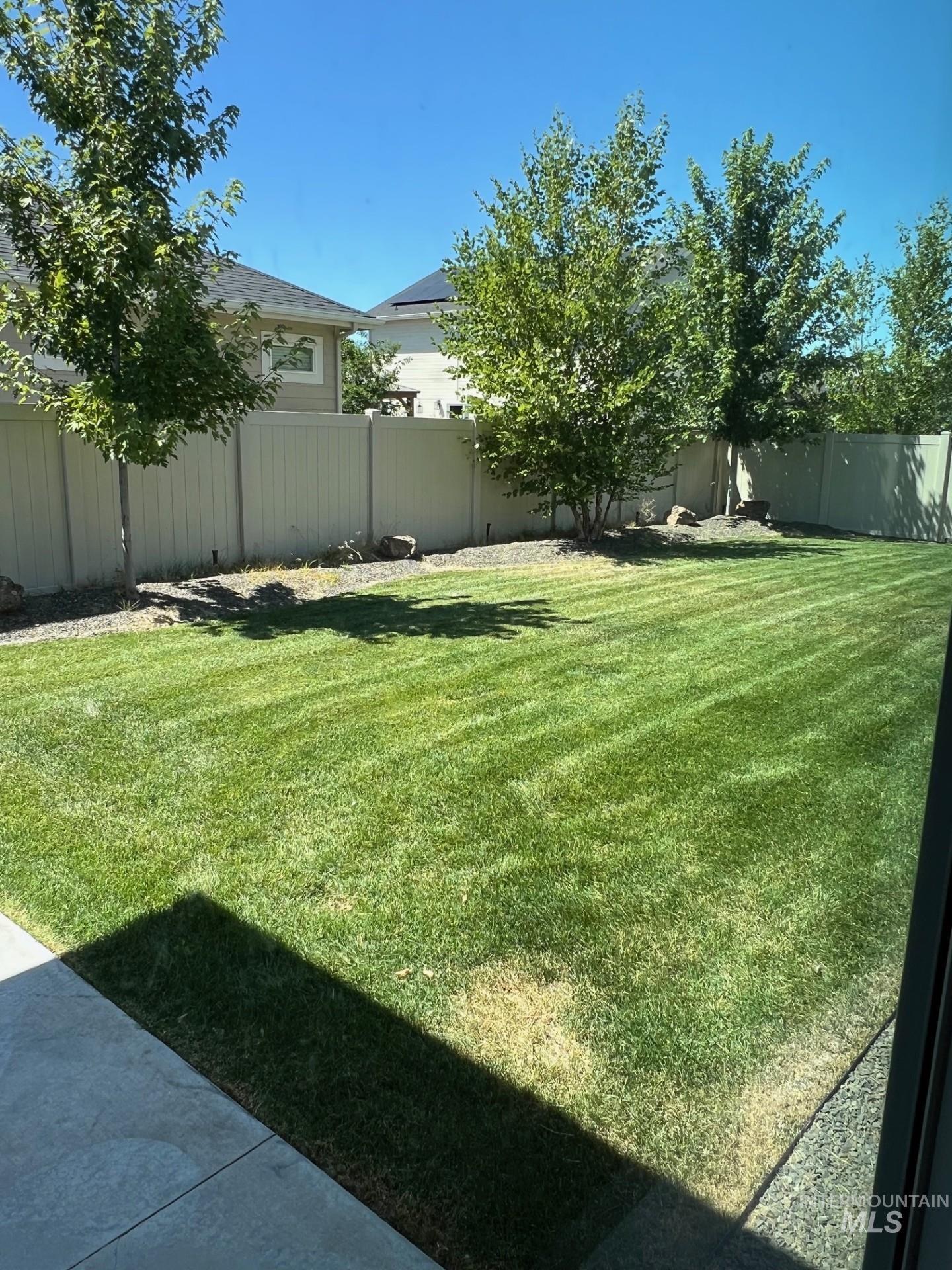 View of fenced backyard
