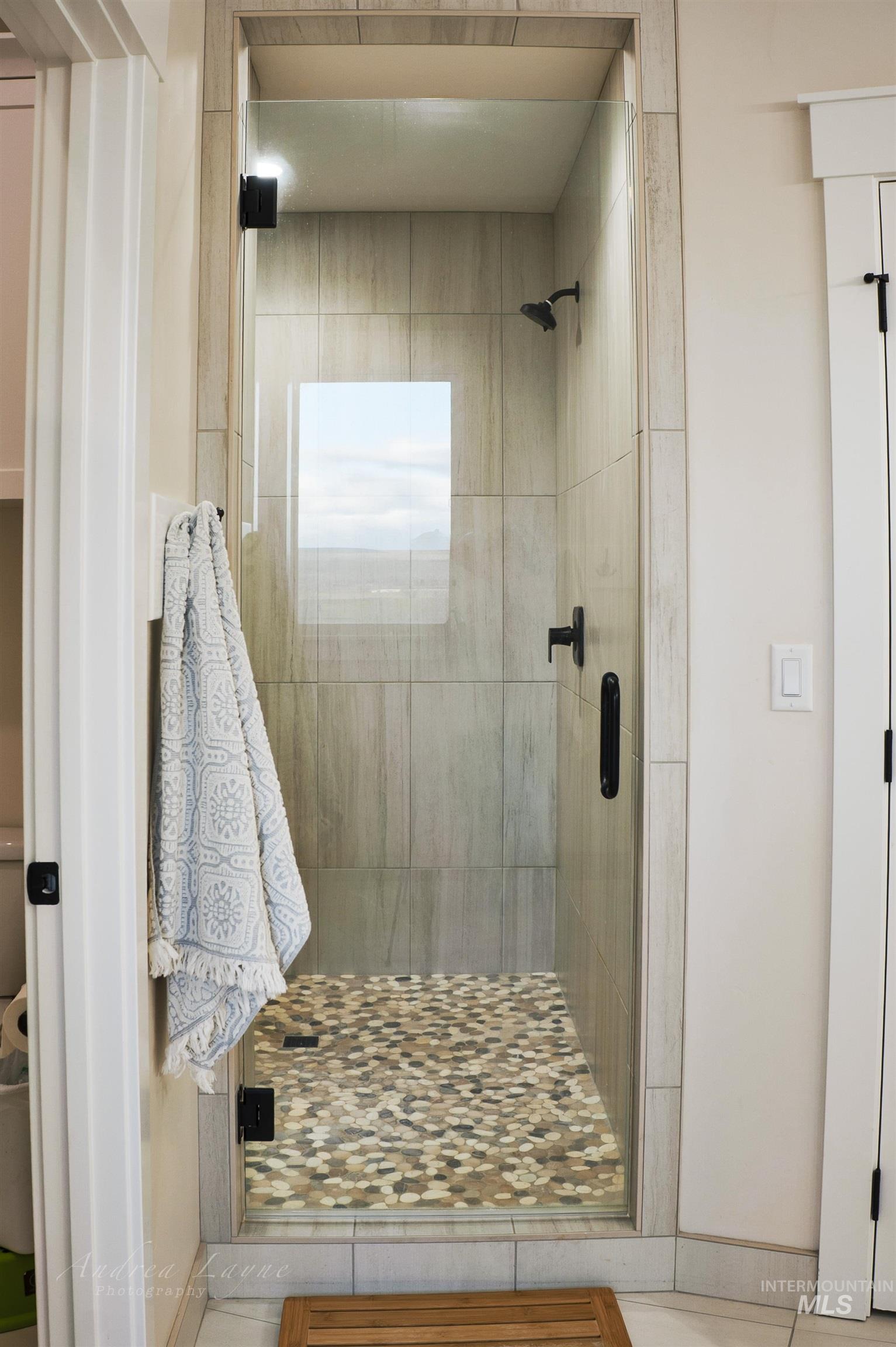 Bathroom featuring a shower stall