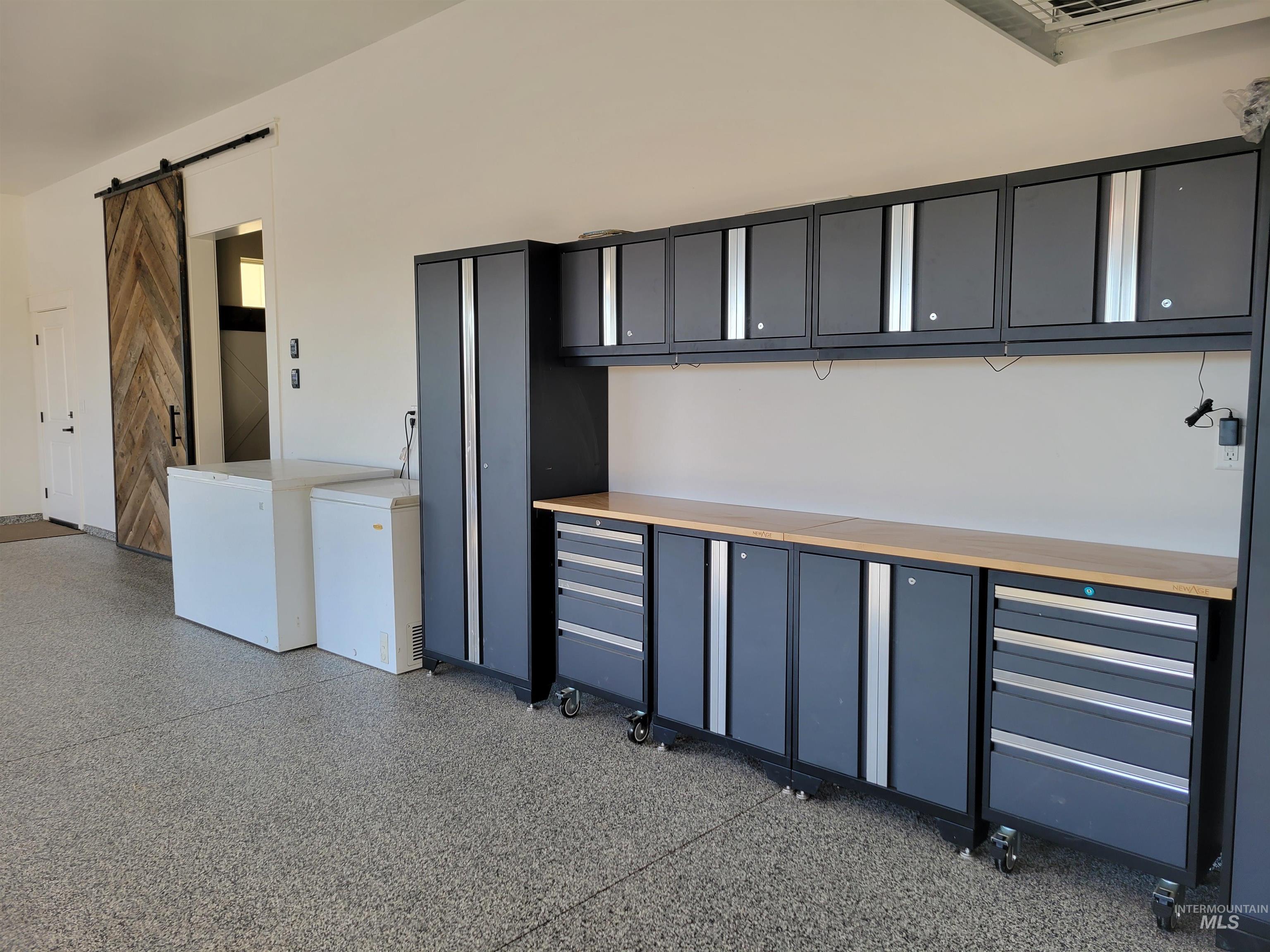 Garage with white fridge and cooling unit