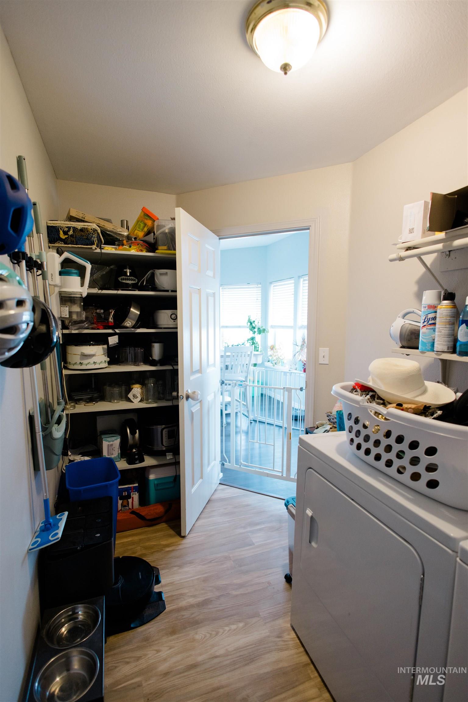 Interior space featuring washer / dryer and light wood-type flooring