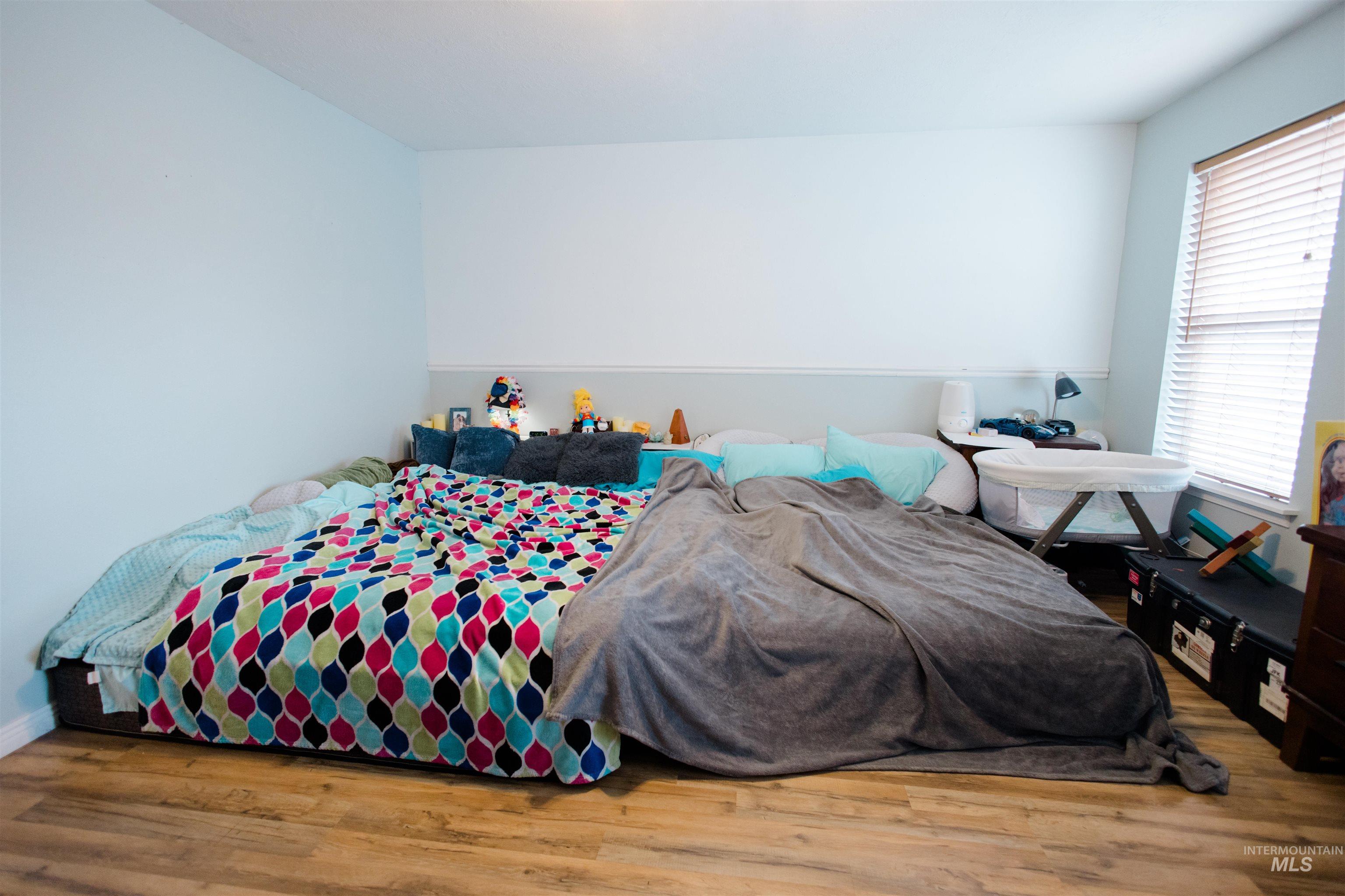 Bedroom with wood finished floors