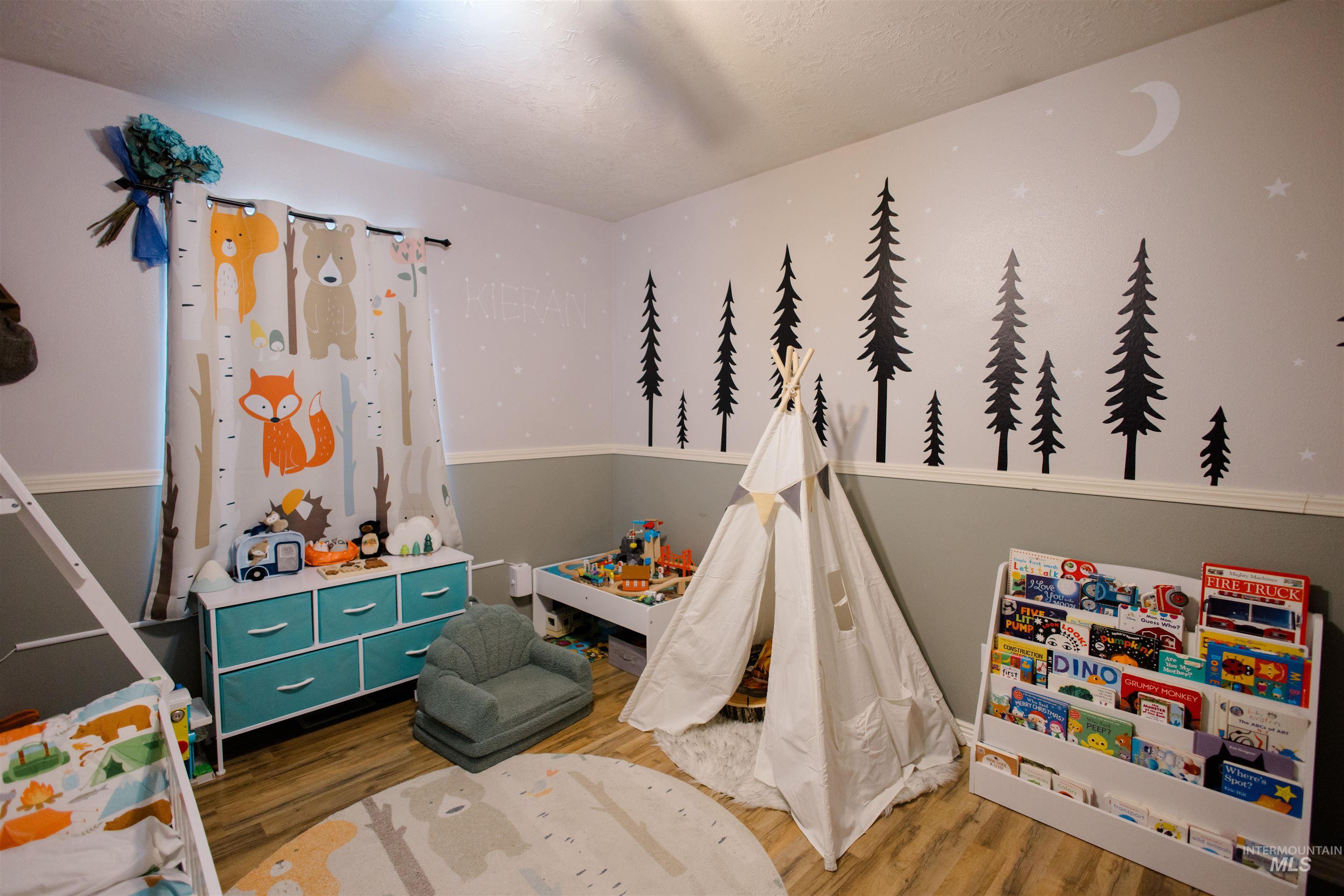 Bedroom with wood finished floors