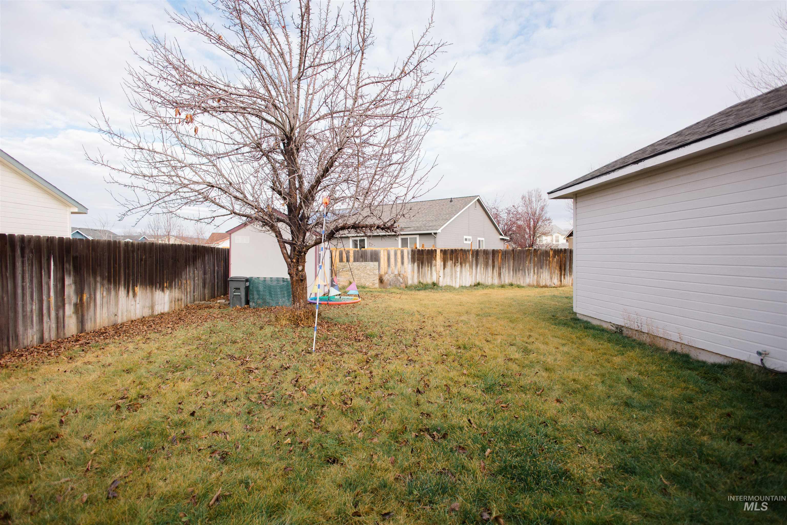 View of fenced backyard