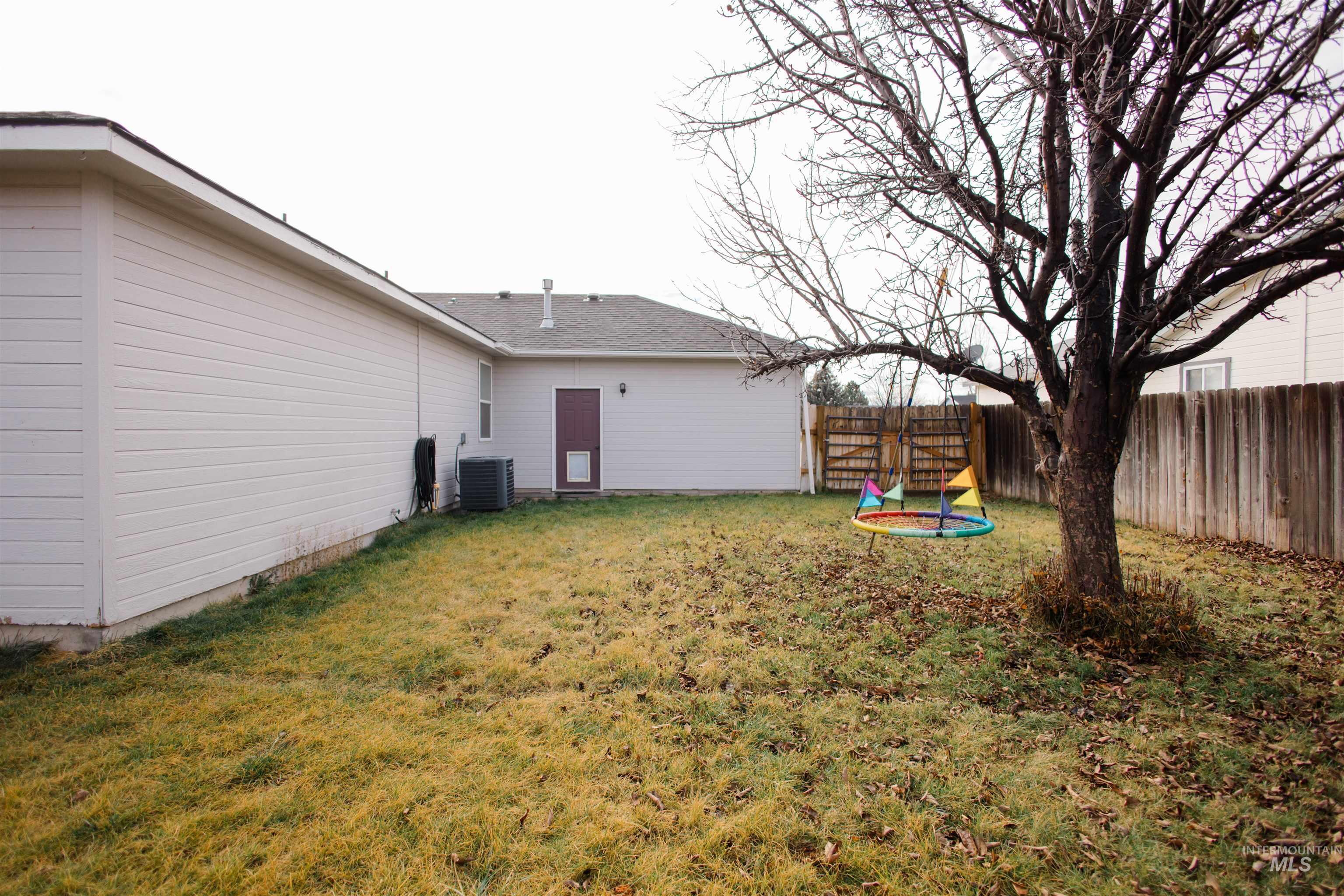 View of fenced backyard